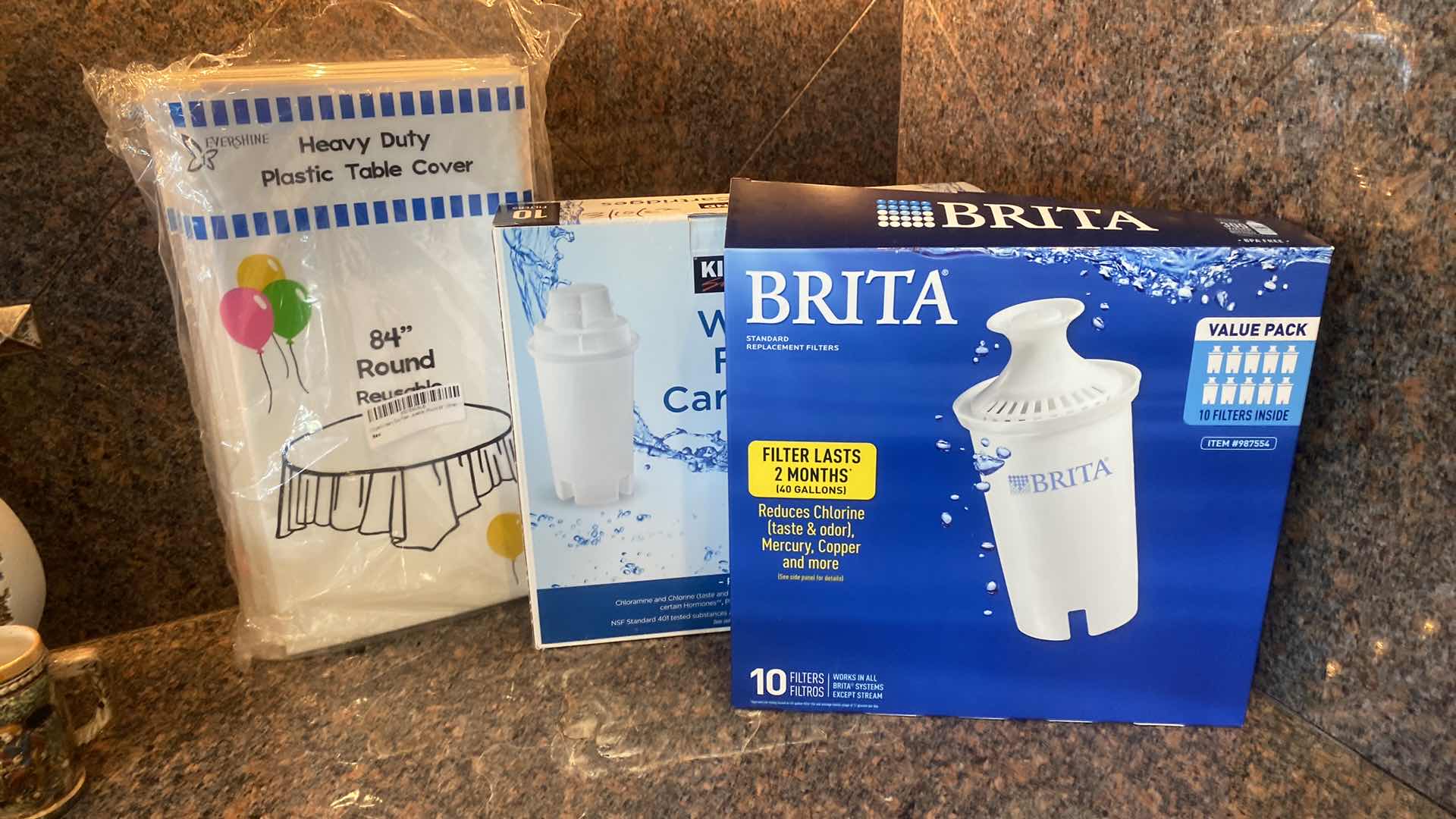 Photo 1 of BRITA & KIRKLAND WATER FILTERS AND PLASTIC TABLECLOTHS