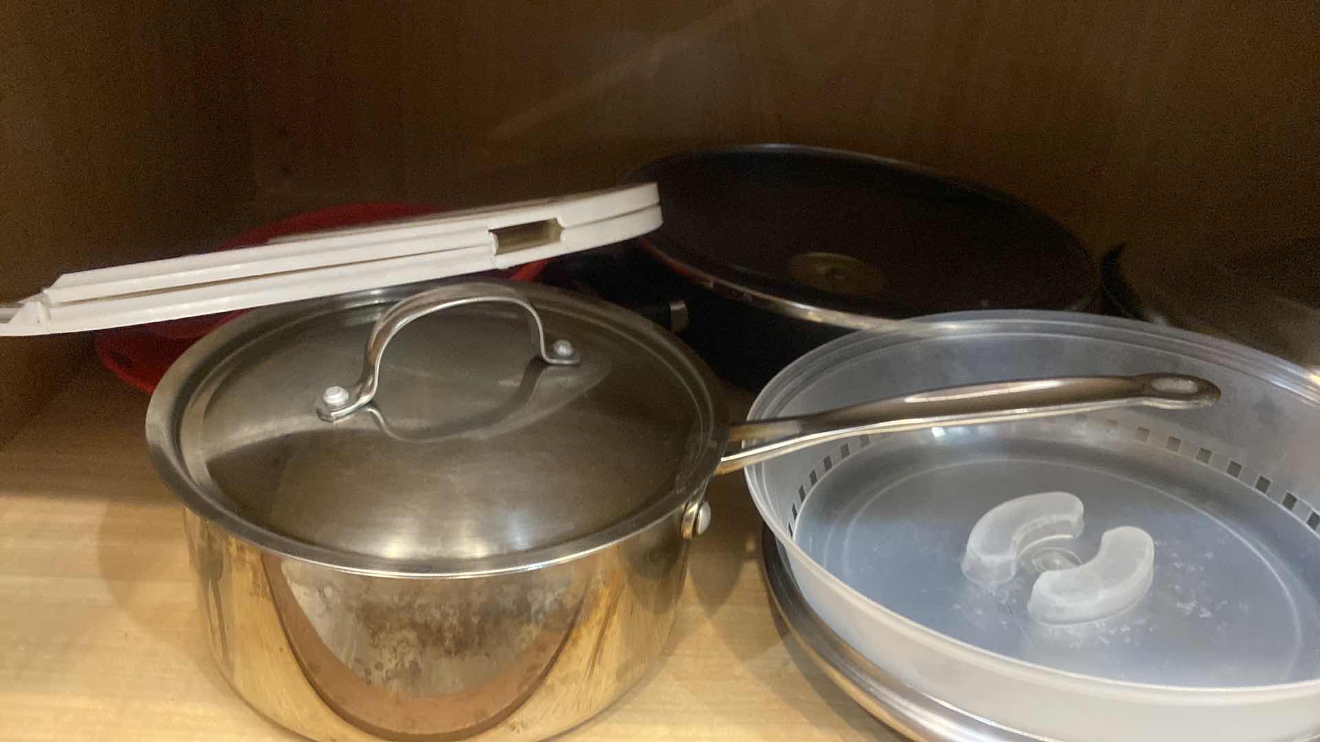 Photo 3 of CONTENTS OF KITCHEN CABINET - POTS & PANS