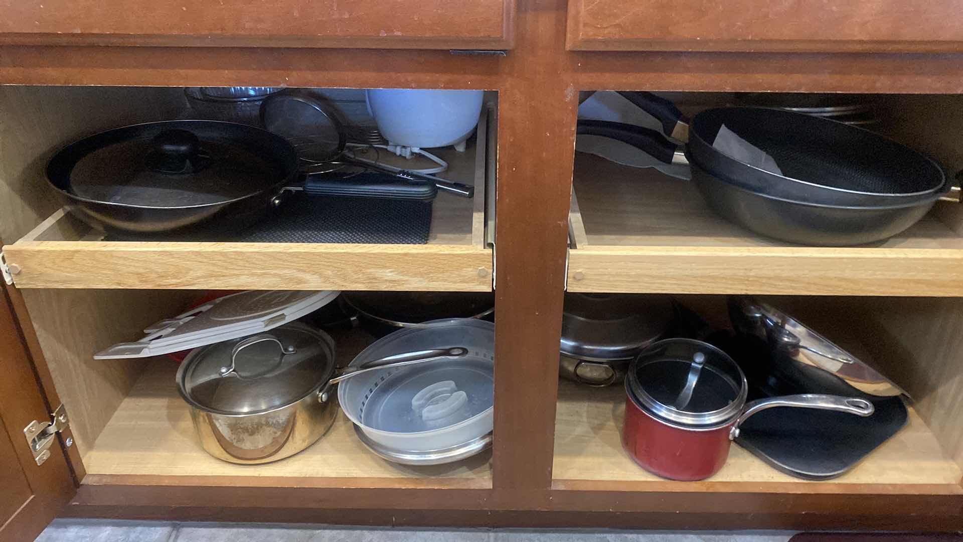 Photo 1 of CONTENTS OF KITCHEN CABINET - POTS & PANS