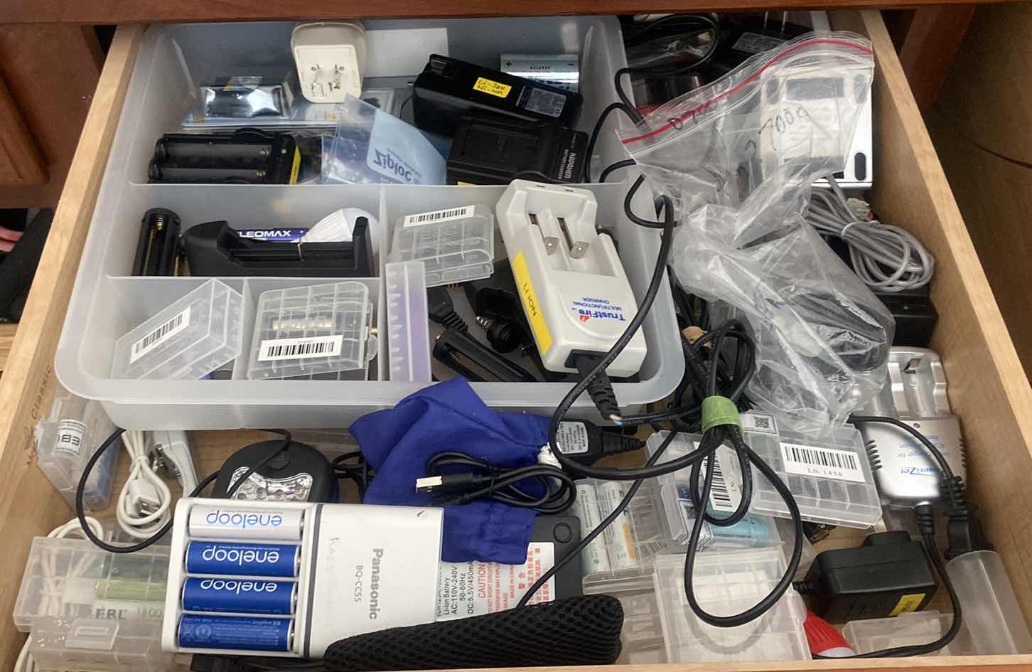 Photo 1 of CONTENTS OF DRAWER IN OFFICE - BATTERIES AND CHARGERS