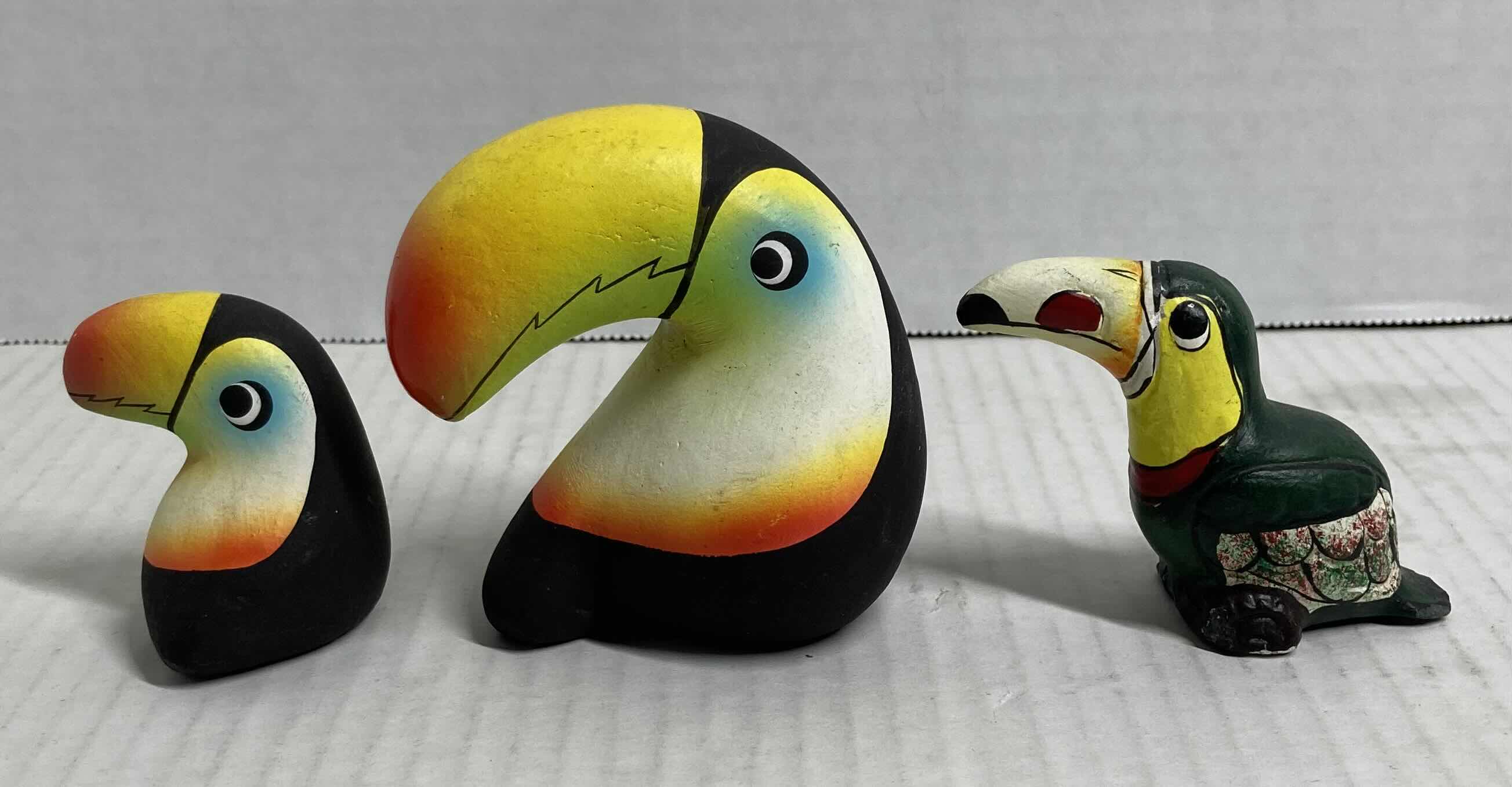 Photo 1 of TROPICAL TOUCAN CERAMIC FIGURINES (3)