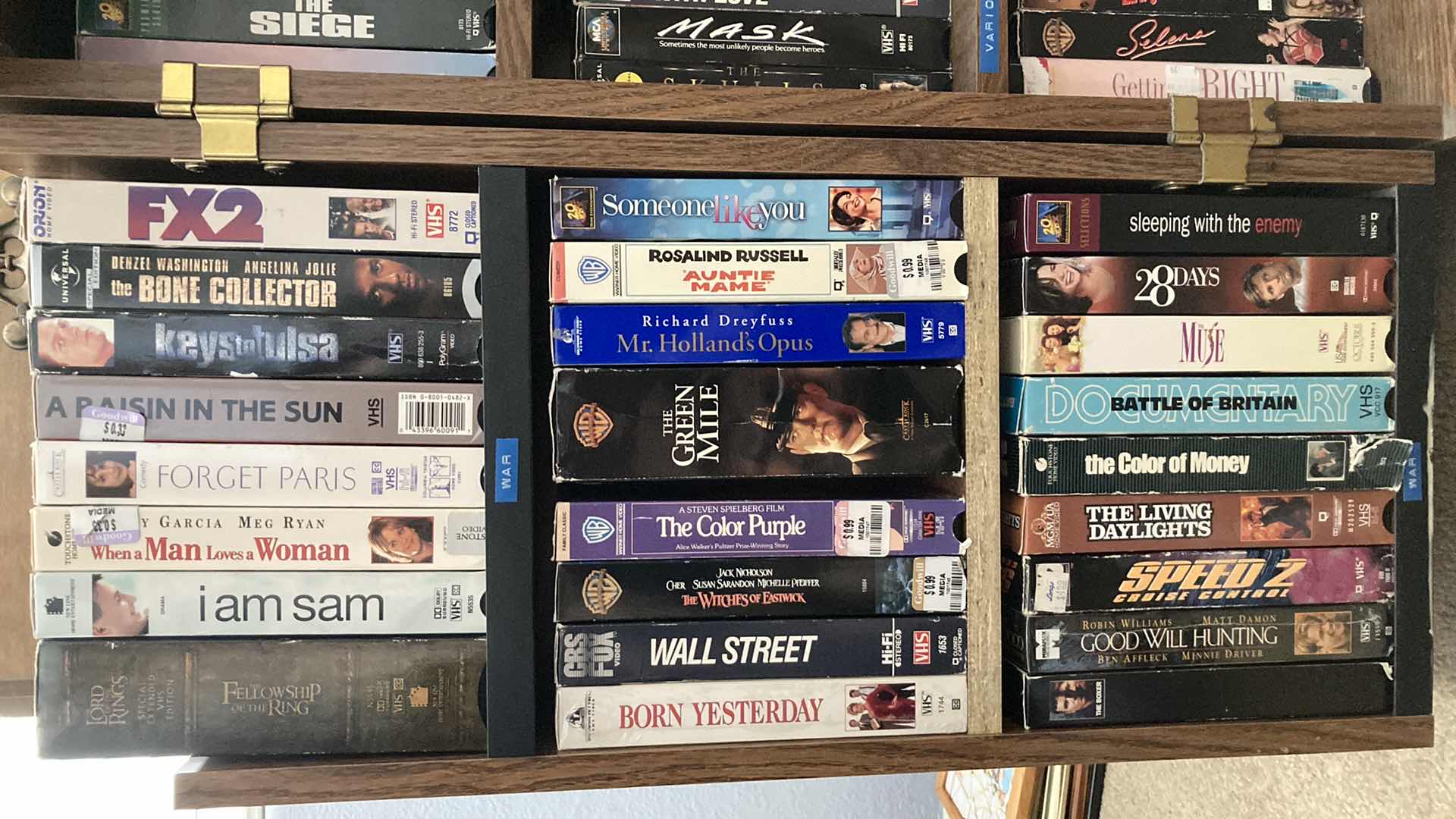 Photo 2 of VHS MOVIES-VARIOUS GENRES W ROLLING VHS STORAGE CABINET 23” X 30” H29.5”