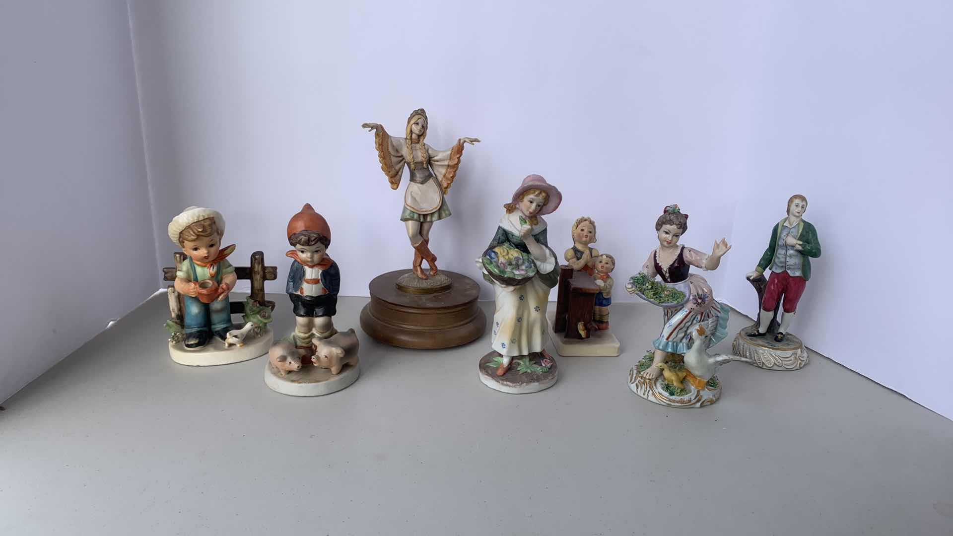 Photo 1 of 7 HANDPAINTED PORCELAIN COLLECTIBLE FIGURINES, ( TALLEST  H 9”)