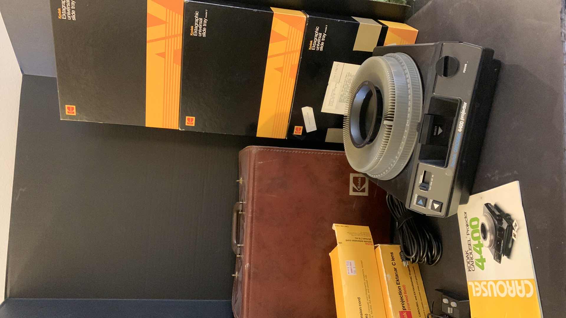 Photo 1 of KODAK CAROUSEL PROJECTOR 4400 IN ORIGINAL LEATHER CASE W ACCESSORIES, 4 BOXES SLIDE TRAYS