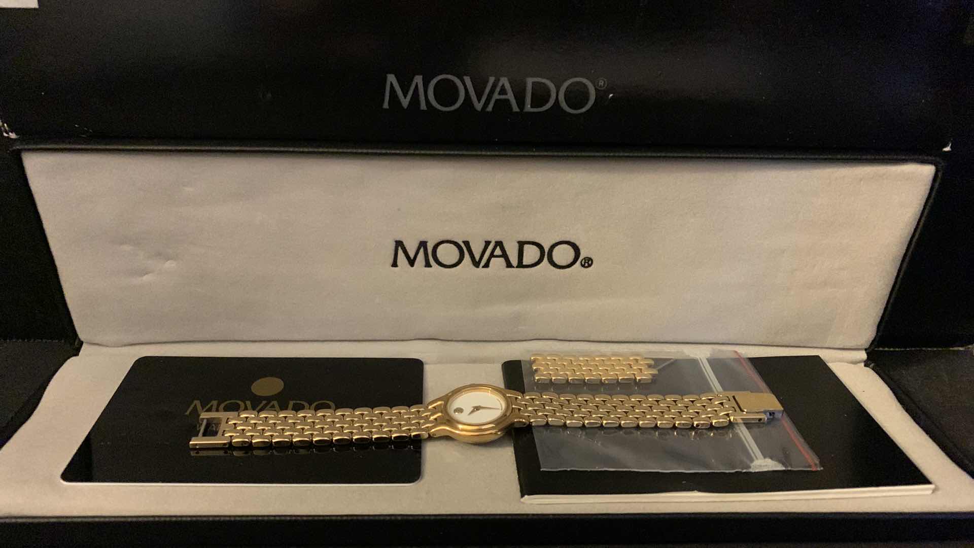 Photo 1 of WOMENS GOLD MOVADO WATCH W BOX, CASE, LINKS, AND RECEIPT $550 in 1990