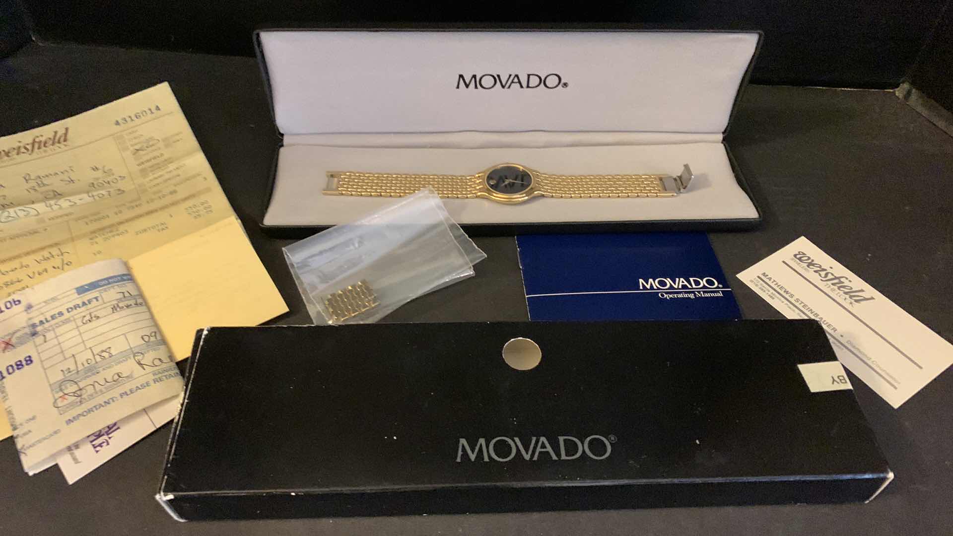 Photo 4 of MENS  GOLD MOVADO WATCH W BOX, CASE, LINKS, AND RECEIPT $650 in 1990