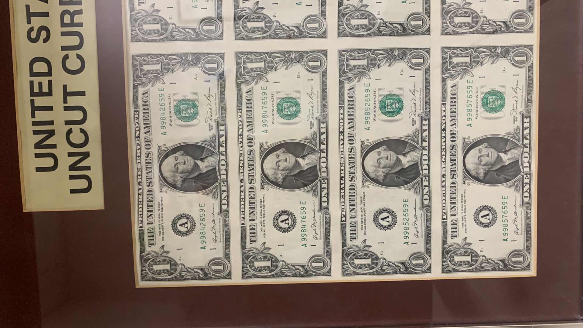 Photo 2 of FRAMED UNITED STATES UNCUT CURRENCY 8- $1 BILLS