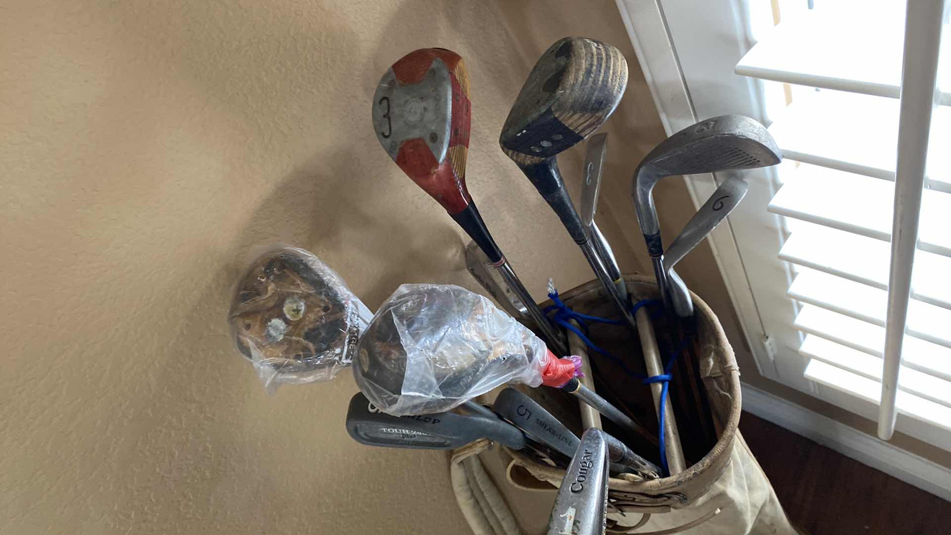 Photo 3 of GOLF BAG WITH ASSORTED CLUBS COUGAR DUNLOP AND MORE