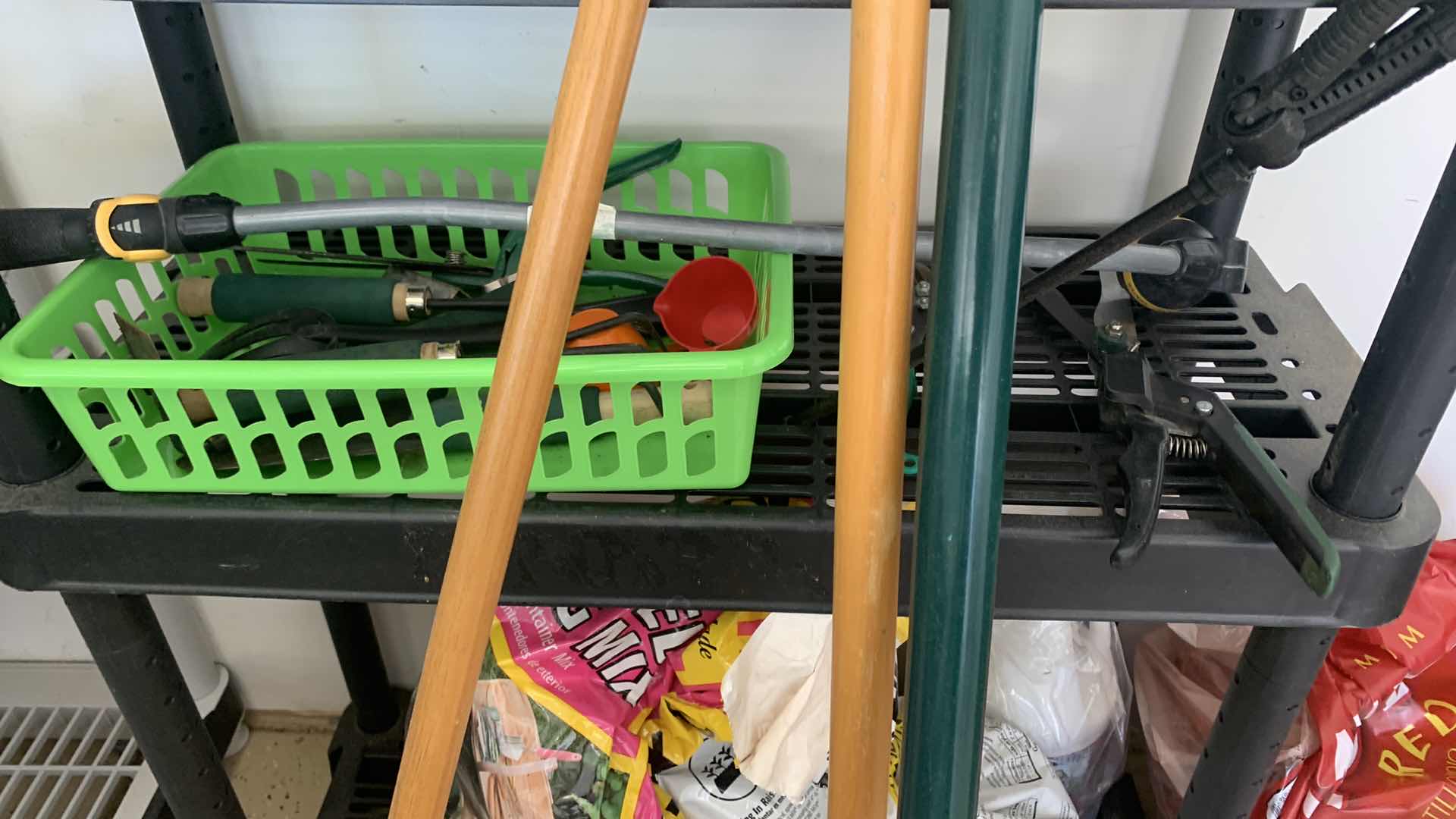 Photo 3 of BLACK SHELF UNIT AND GARDENING SUPPLIES