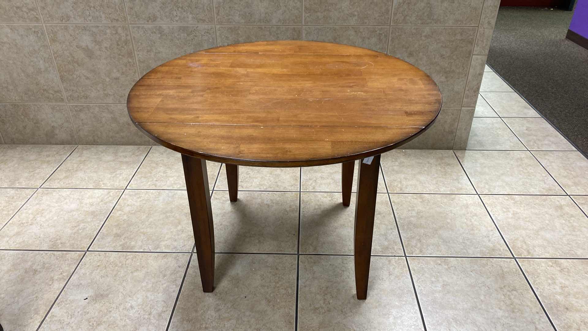 Photo 3 of WOOD DROP LEAF TABLE FULLY EXTENDED 42” X H30”, NOT EXTENDED 42” X 28” H30”