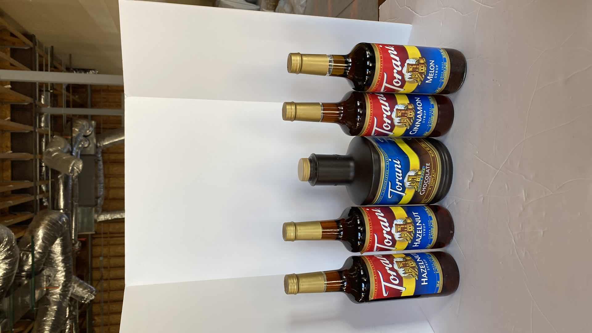Photo 1 of TORANI CHOCOLATE SAUCE AND 4 SYRUPS UNKNOWN EXPIRATION DATES
