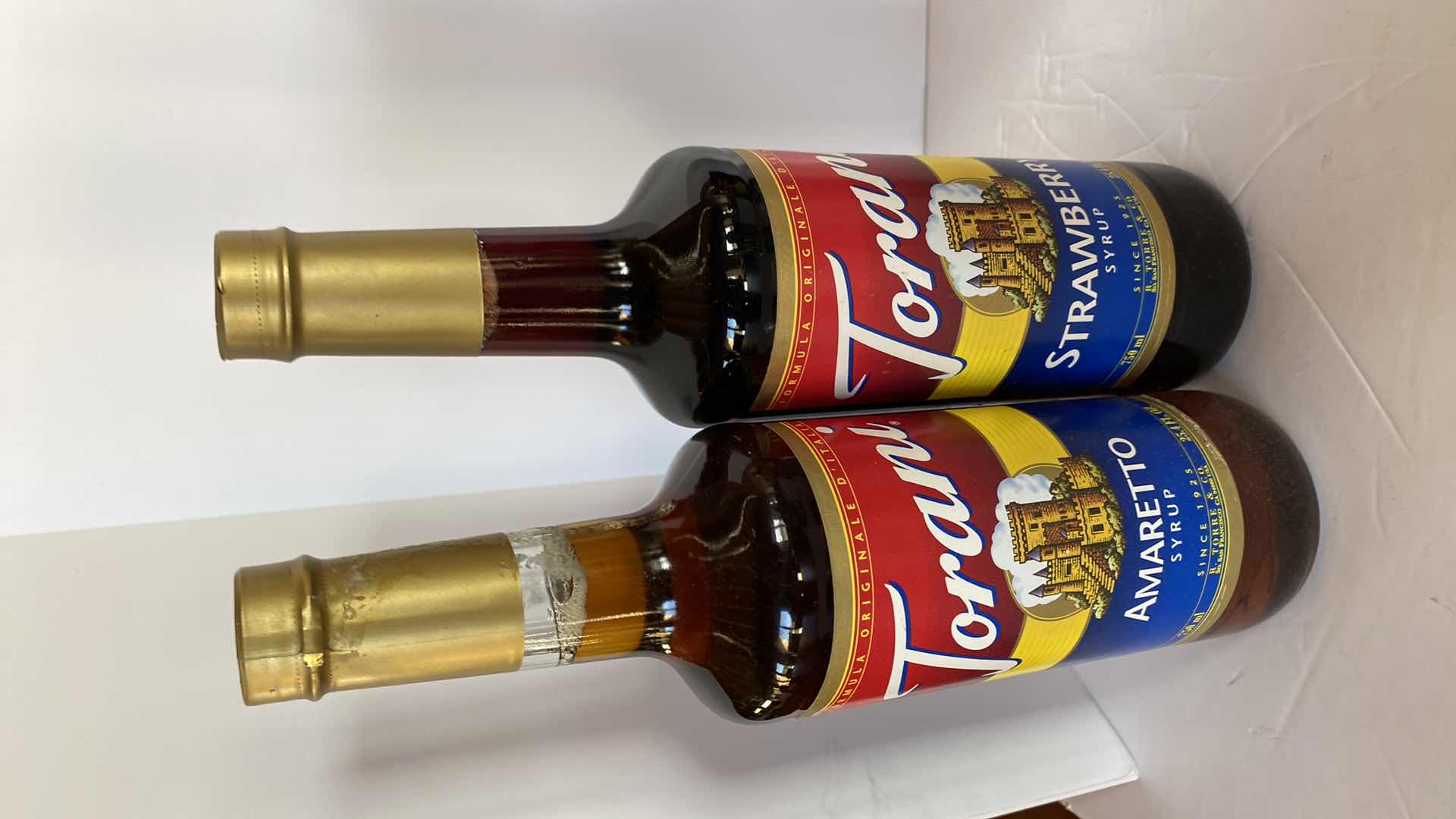 Photo 2 of TORANI CHOCOLATE SAUCE AND 4 SYRUPS UNKNOWN EXPIRATION DATES, INCLUDES TOTE