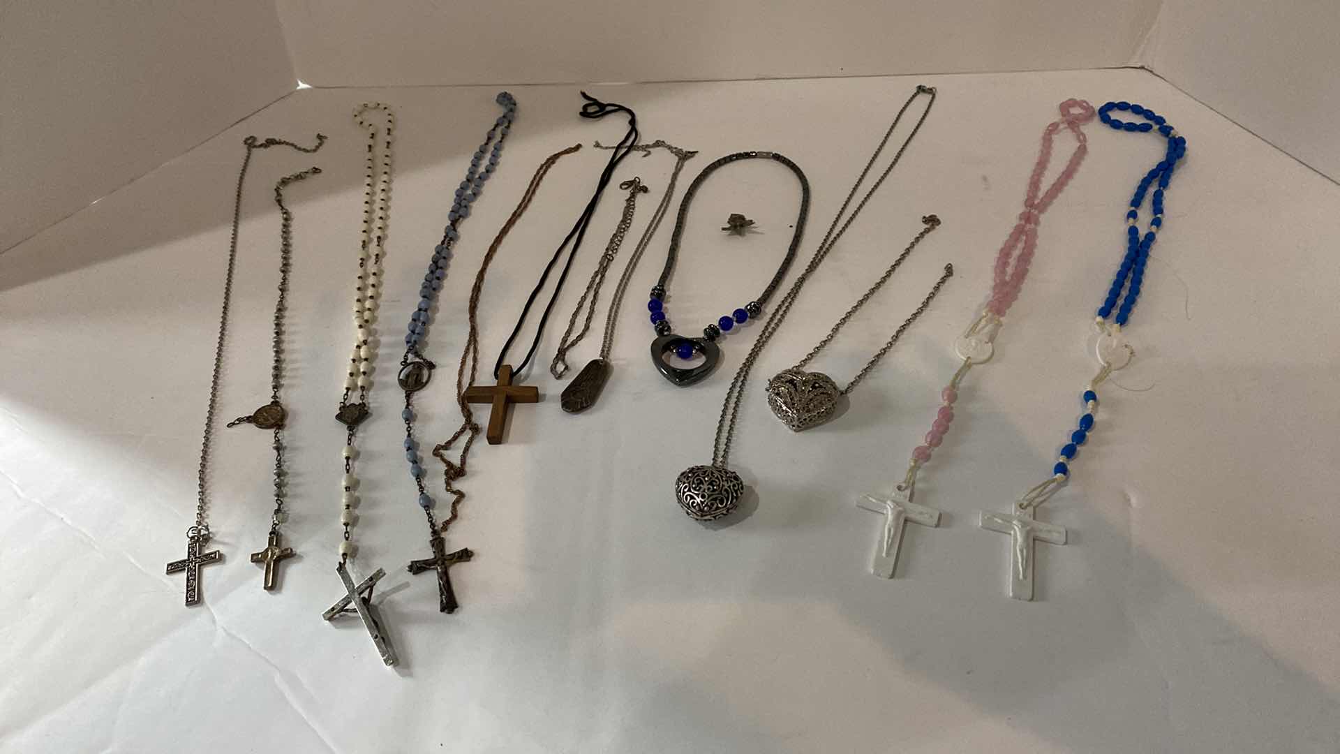 Photo 1 of ASSORTED ROSARIES AND COSTUME JEWELRY