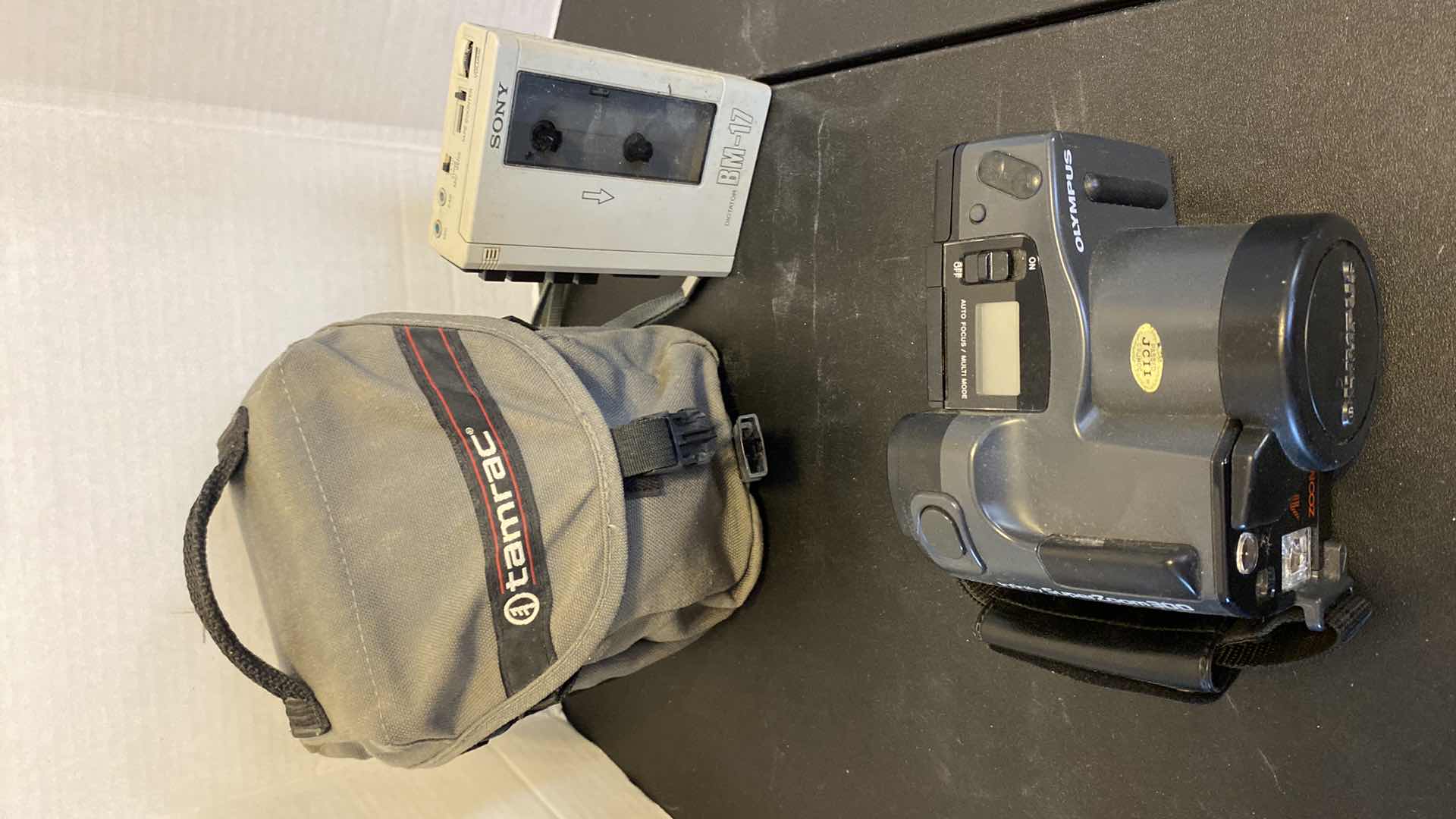 Photo 1 of OLYMPUS INFINITY SUPER ZOOM 300 CAMERA WITH CASE AND SONY CASSETTE DICTATOR