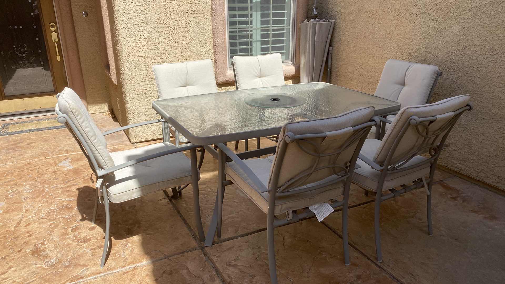 Photo 1 of 7 PIECE ALUMINUM AND GLASS PATIO TABLE WITH 6 CHAIRS 62” X 40” (CUSHIONS INCLUDED)