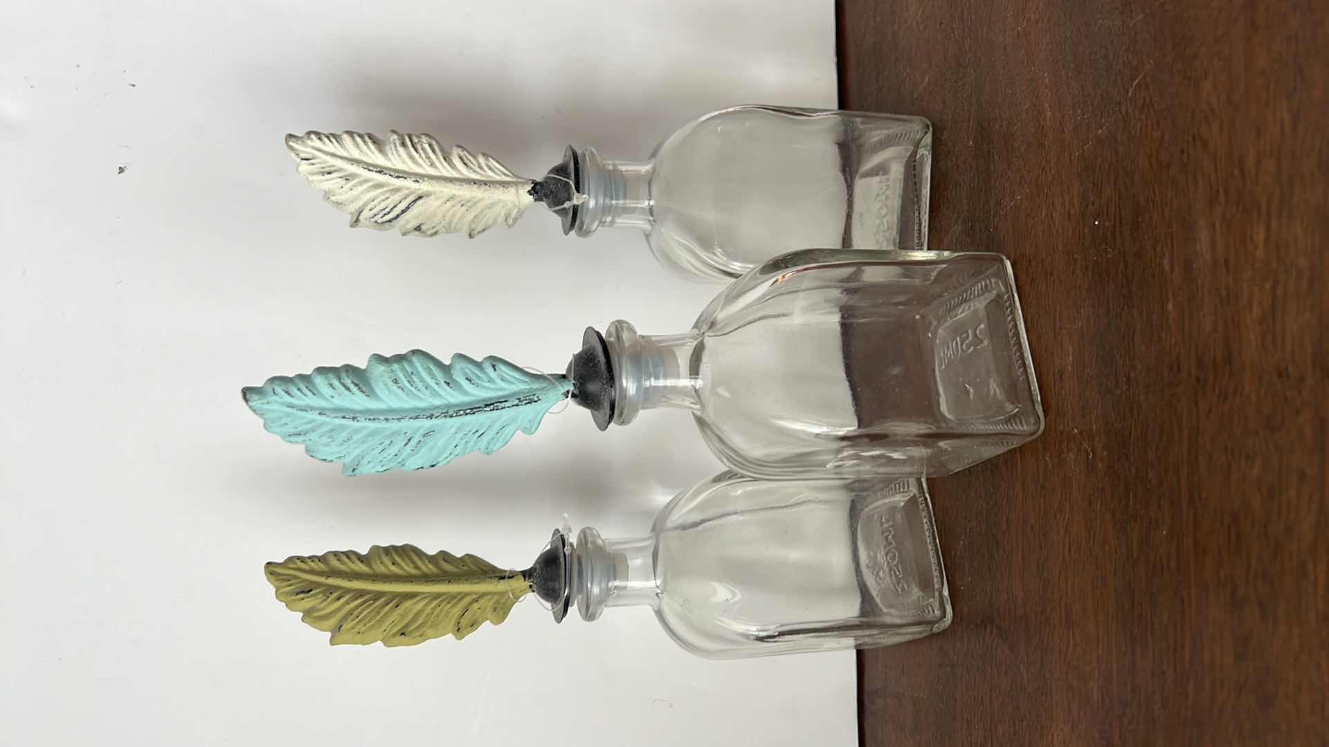 Photo 2 of 3-FEATHER GLASS DECORATIVE BOTTLES