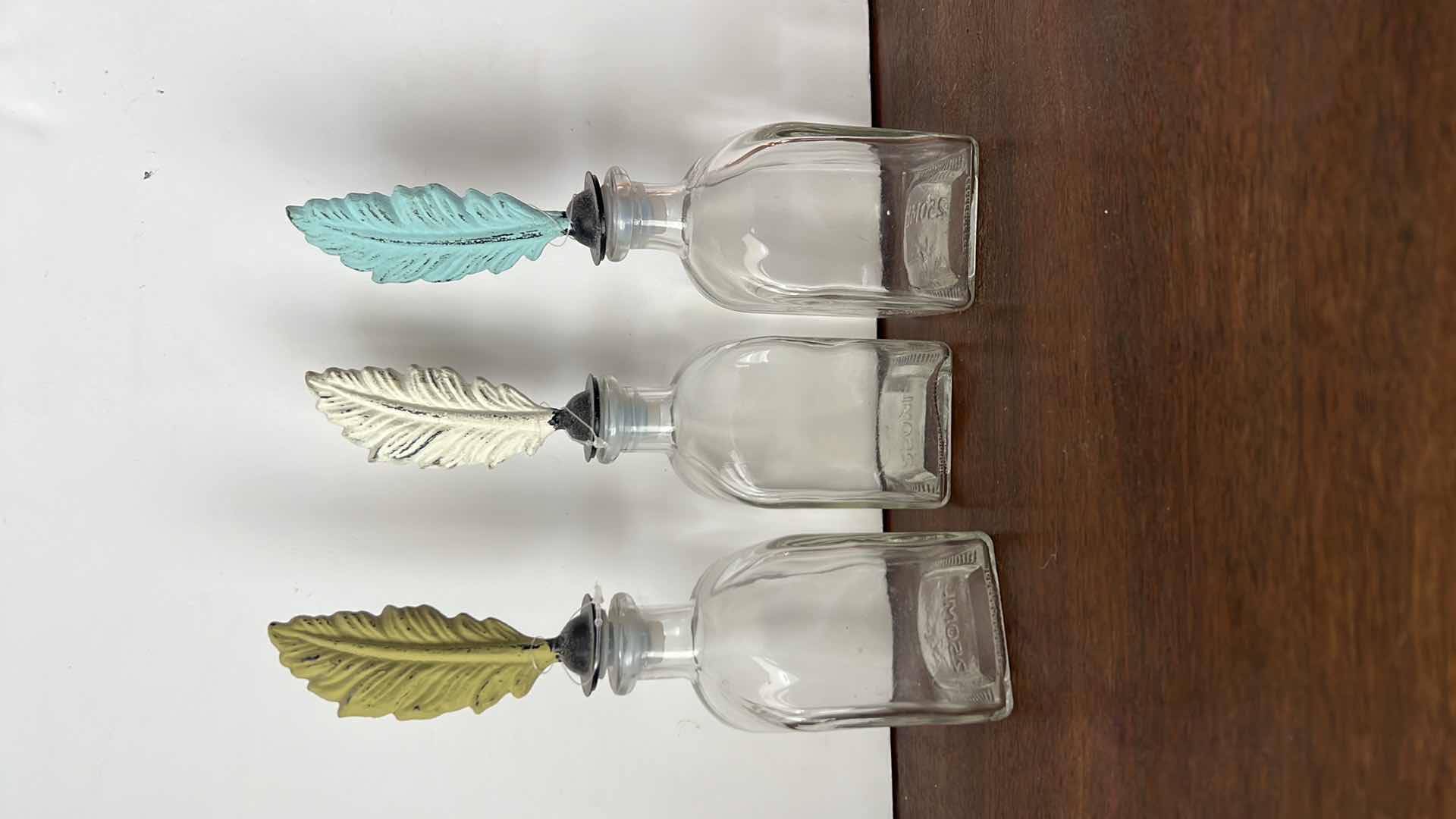 Photo 1 of 3-FEATHER GLASS DECORATIVE BOTTLES