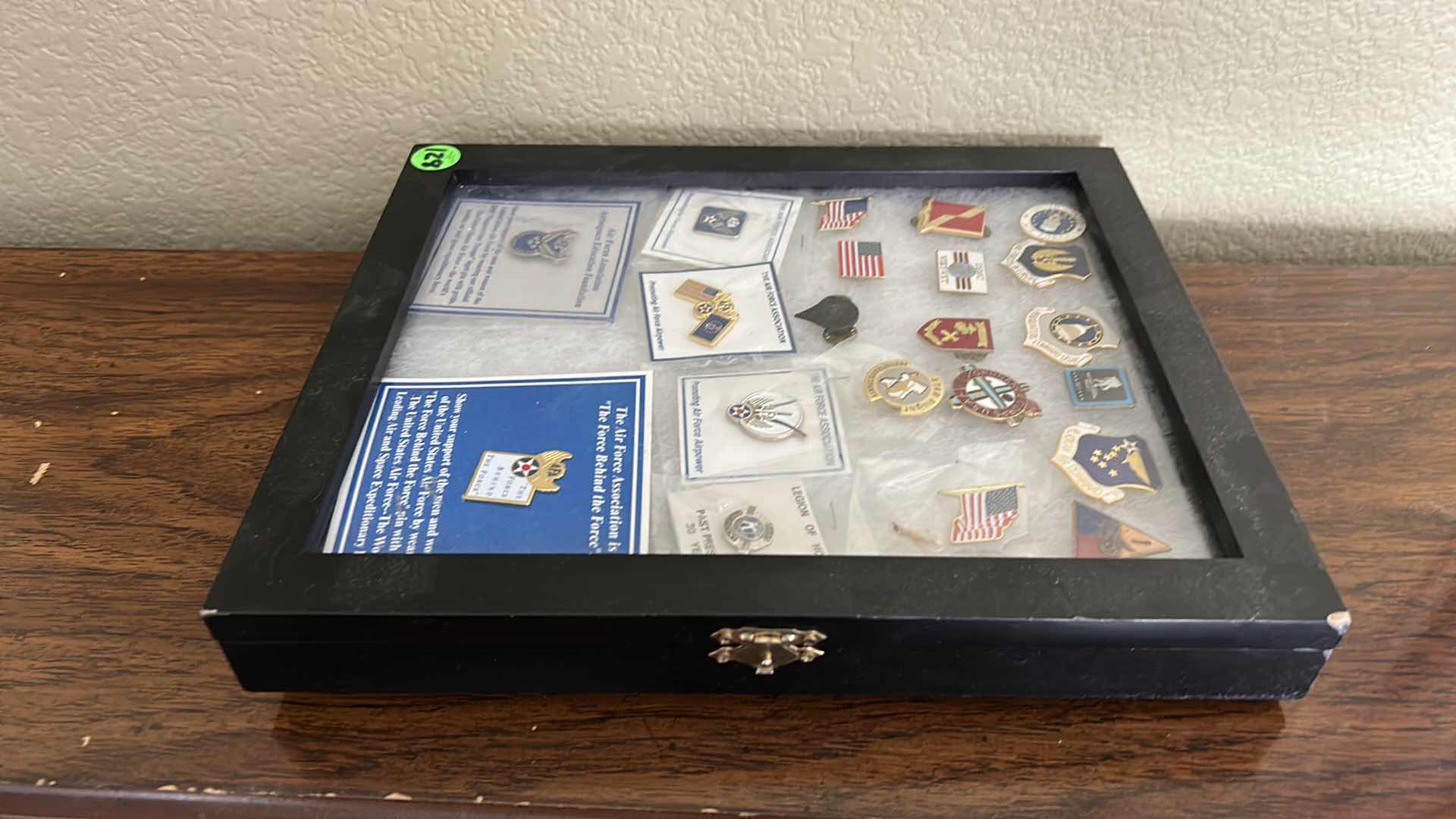 Photo 2 of MILITARY AND FLAG PINS IN LATCHED SHADOW BOX