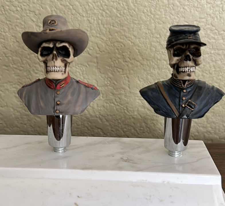 Photo 1 of HOME DECOR - MILITARY SKULLS ON STAND ( STAND WITH SKULLS MEASURES 7” x 4” x 4 1/2”