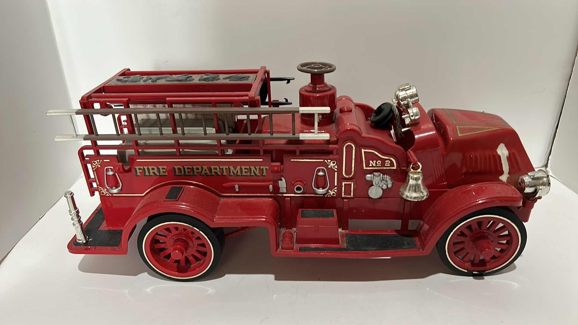 Photo 2 of COLLECTIBLE LIQUOR BOTTLES FIRE TRUCK MEASURES 17“ x 6 1/2“ x 7“