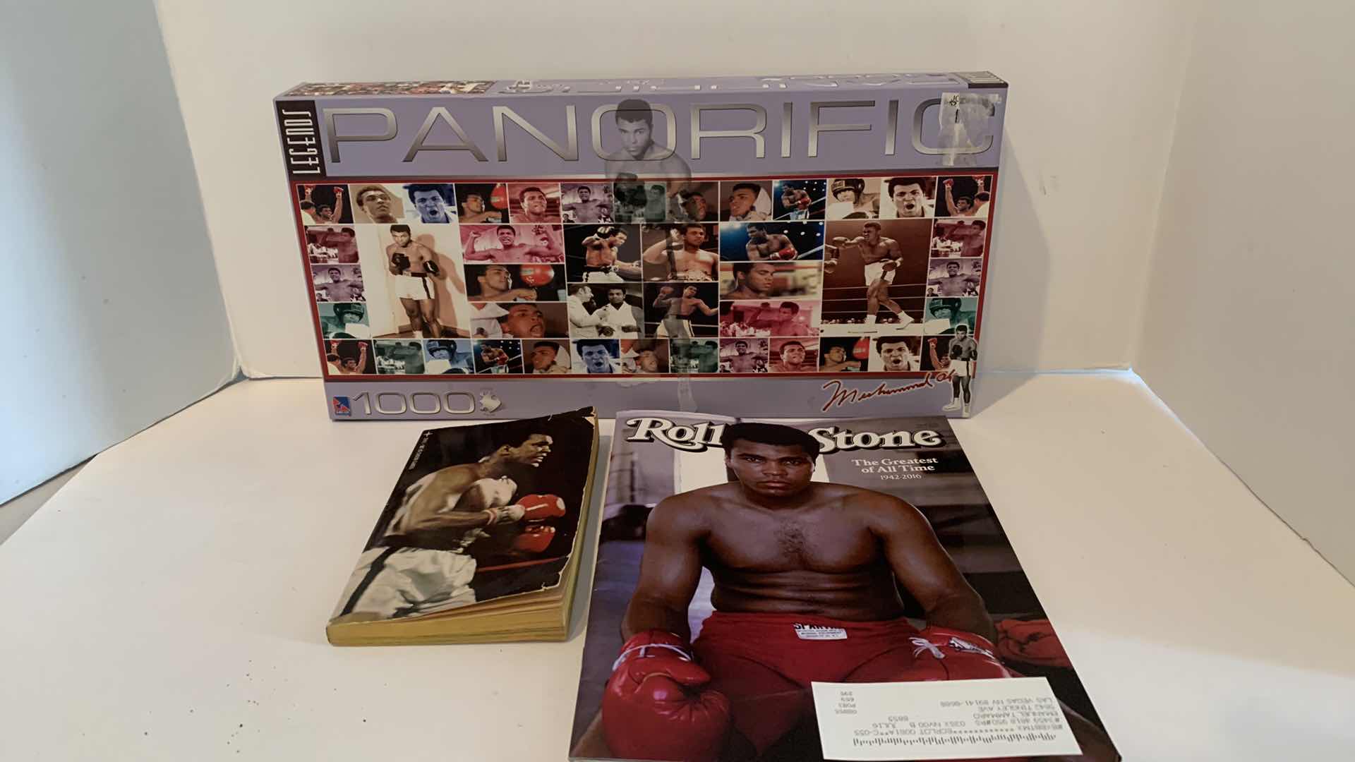 Photo 1 of MUHAMMAD ALI PUZZLE, ROLLING STONE MAGAZINE, AND PAPERBACK BOOK