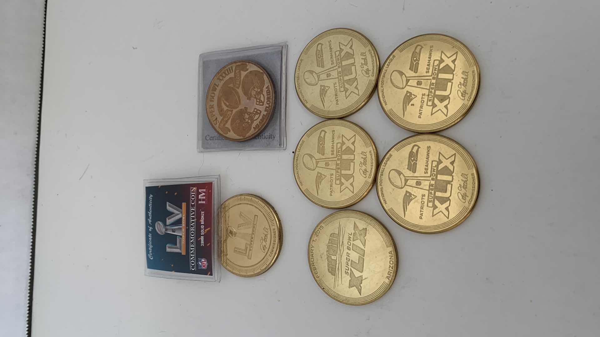 Photo 1 of NFL FOOTBALL SUPERBOWL BRONZE COINS