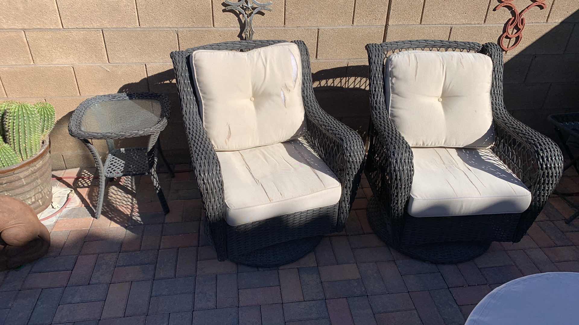 Photo 1 of TWO RATTAN GLIDER PATIO CHAIRS WITH MATCHING TABLE
