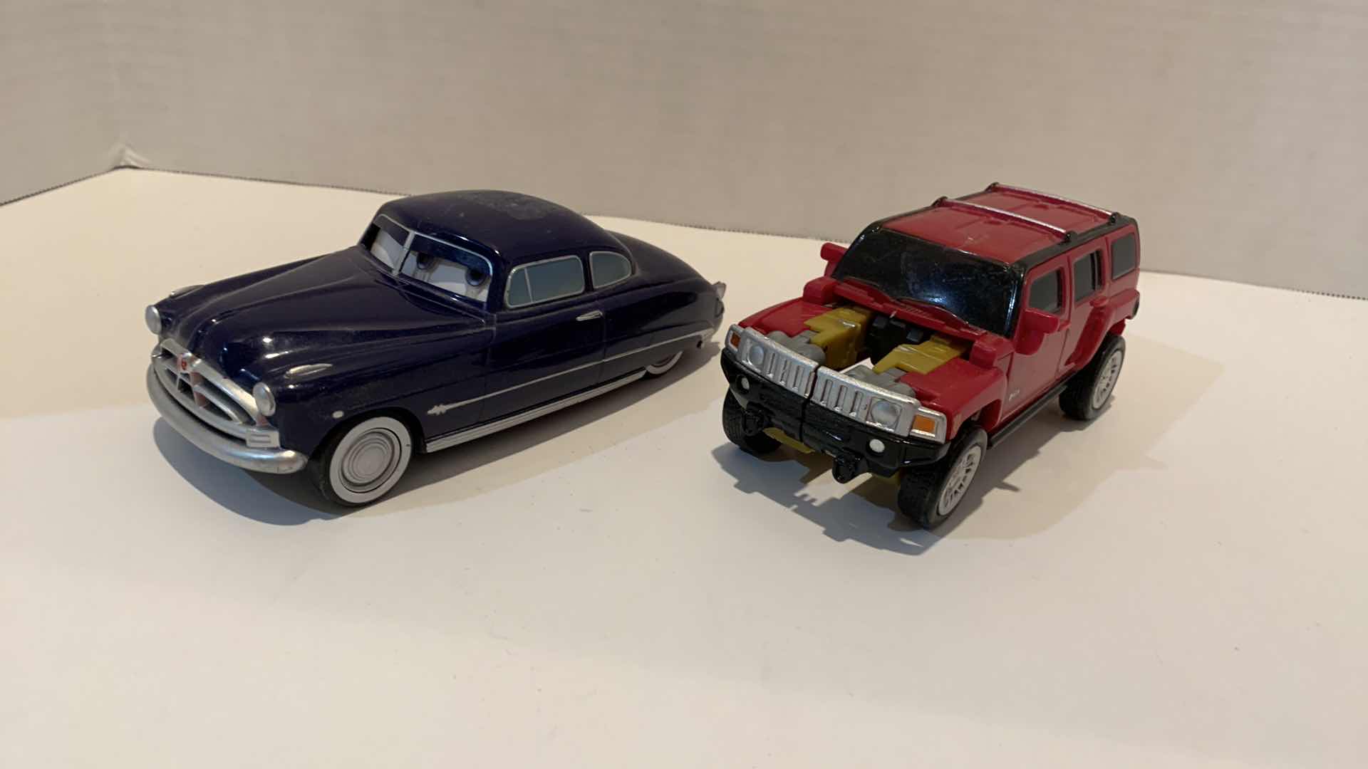 Photo 1 of 2 COLLECTABLE CAR TOYS ONE IS TRANSFORMER