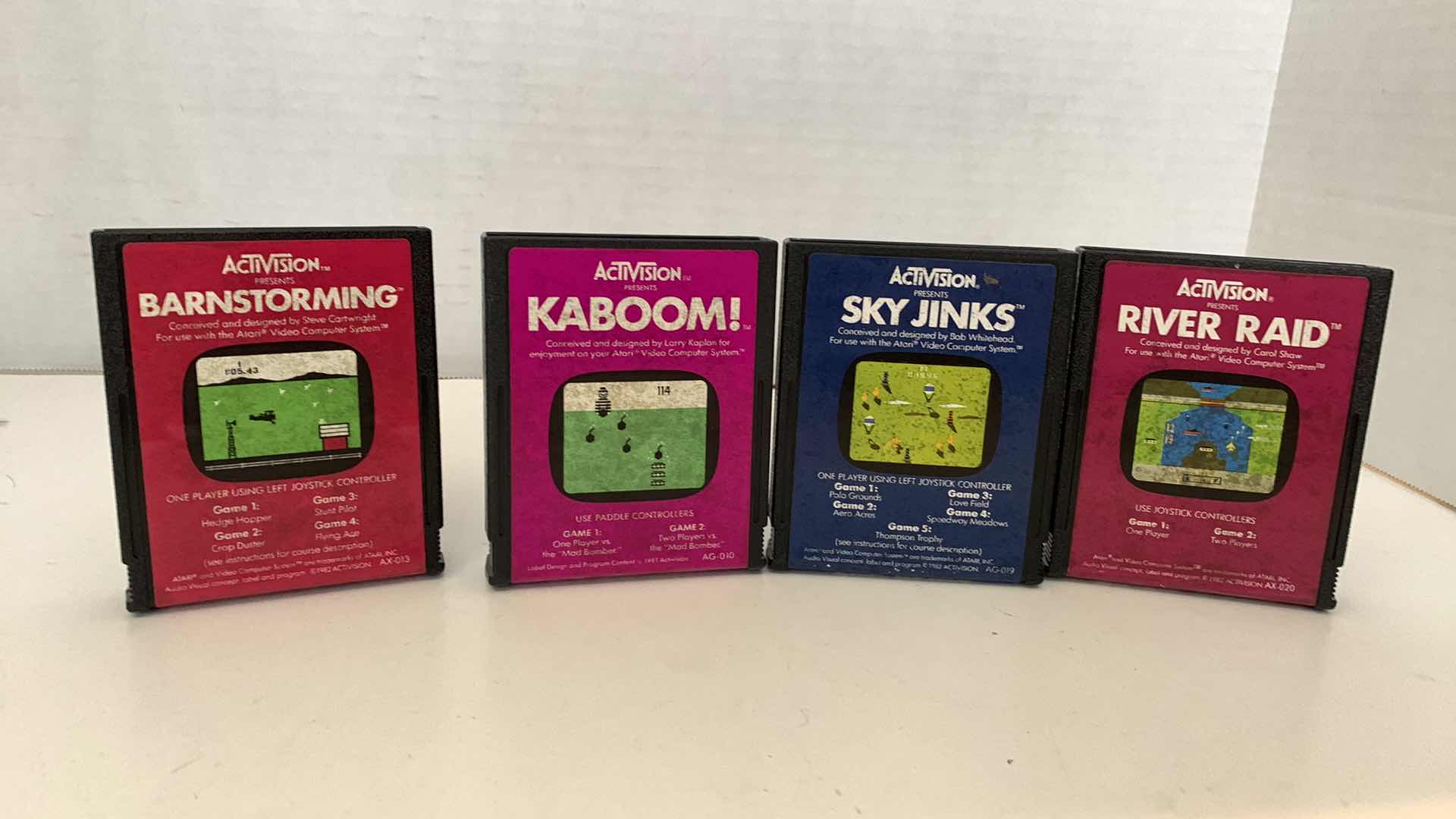 Photo 1 of 4 PCS VINTAGE ATARI 2600 GAMES:BARNSTORMING,KABOOM,SKY JINKS, AND RIVER RAID