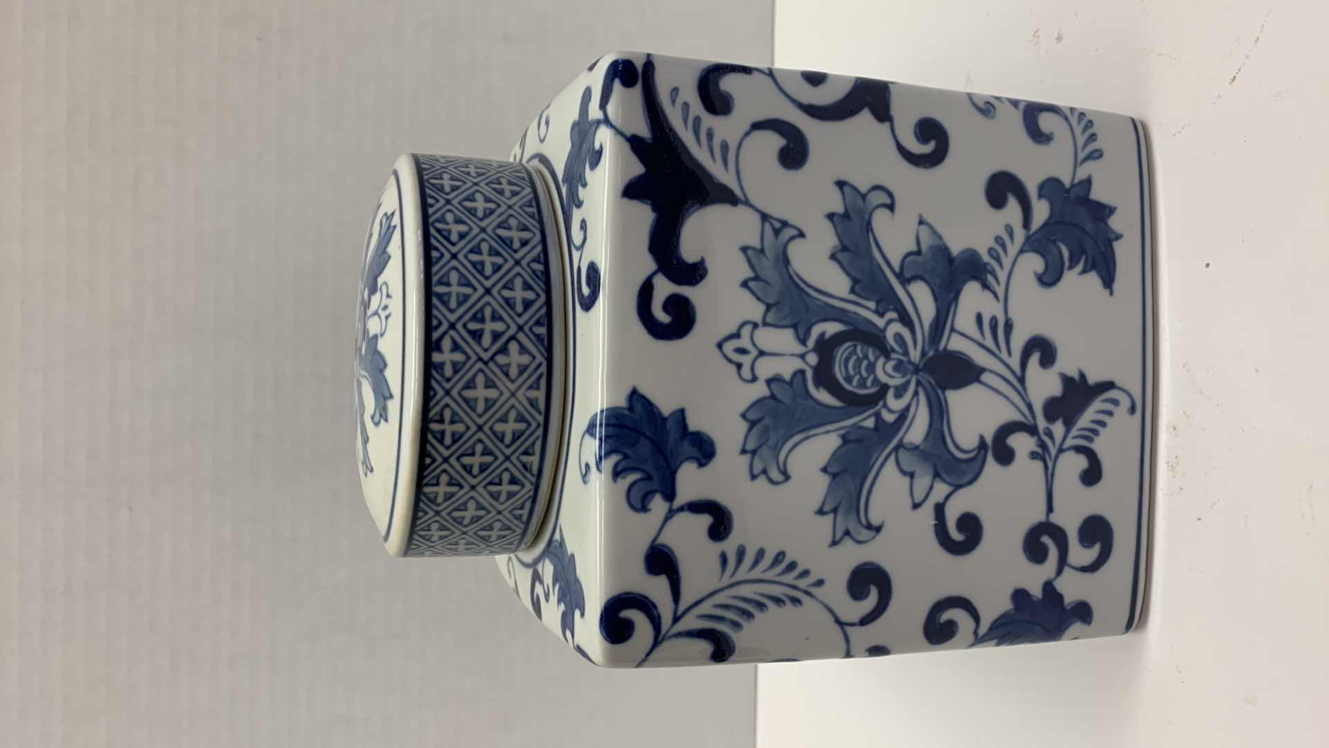 Photo 1 of CERAMIC WHITE AND BLUE JAR 6” X 8”