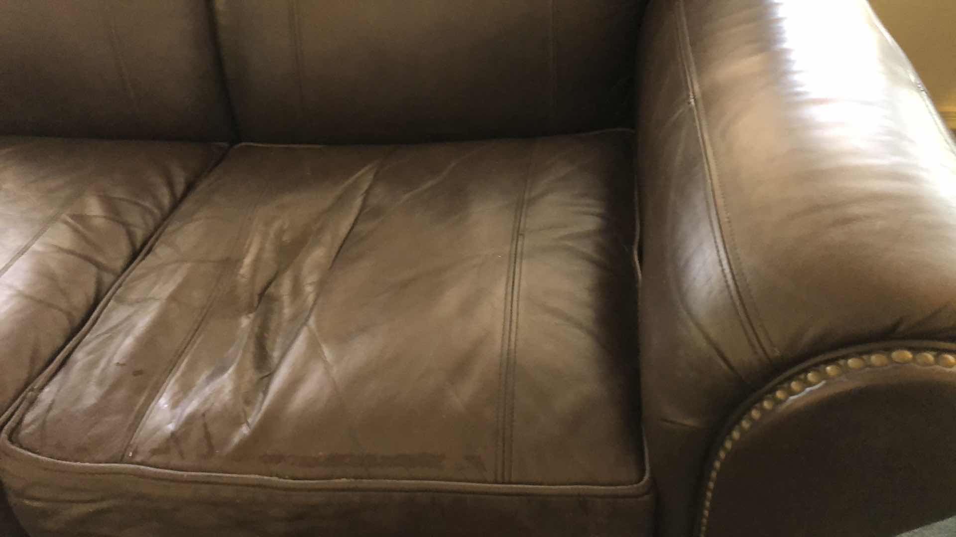 Photo 2 of LEATHER NAIL HEAD LOVE SEAT 63” X 38” H 36”