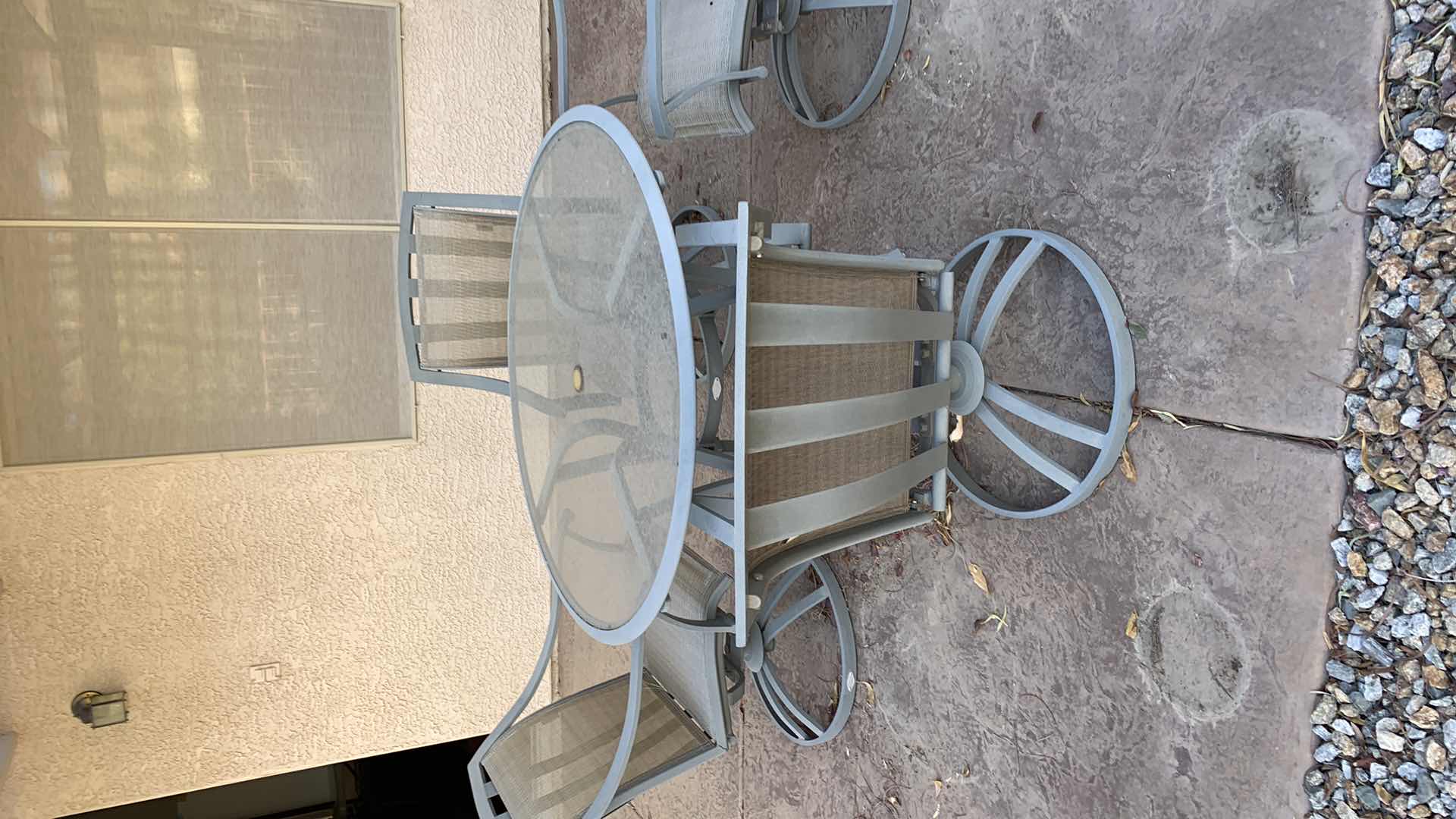 Photo 1 of ALUMINUM PATIO TABLE W 4-SWIVEL ROCKING ARM CHAIRS