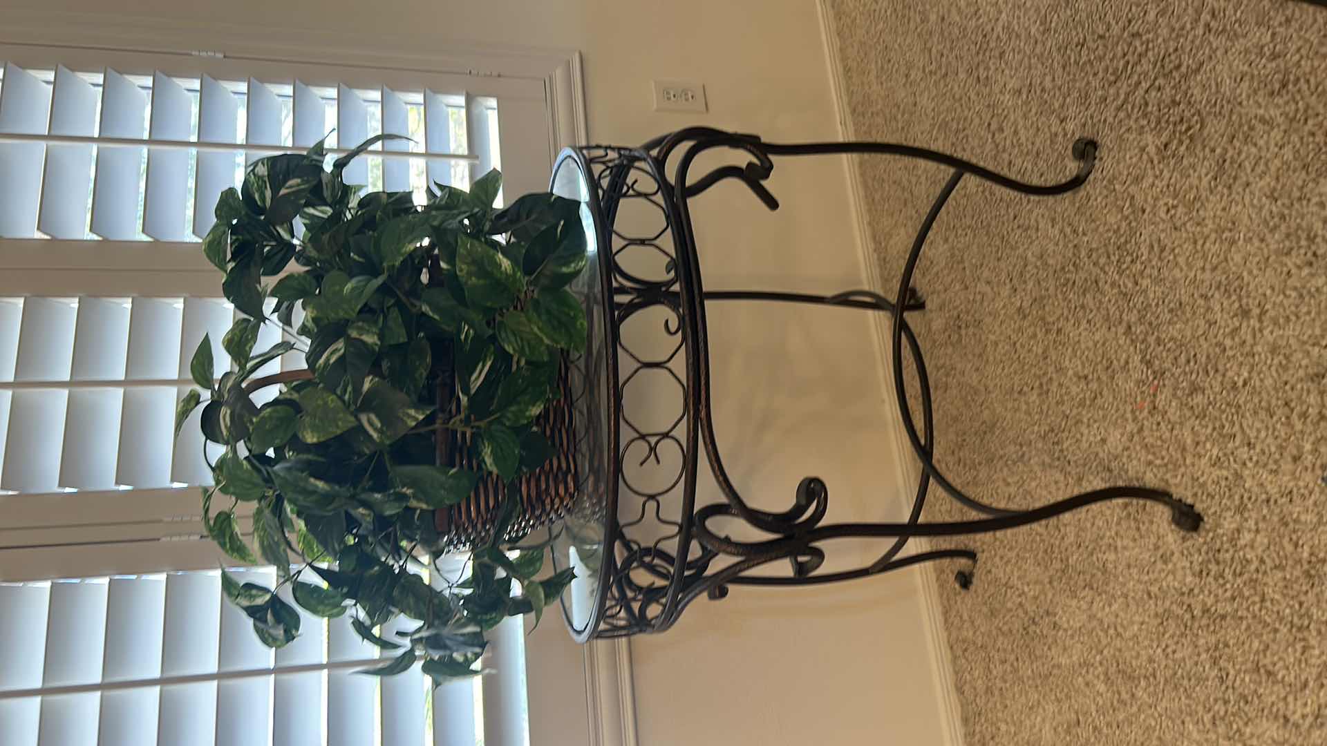Photo 1 of BLACK AND GOLD WROUGHT IRON GLASS TOP TABLE WITH FAUX PLANT 26” x 28 1/2”