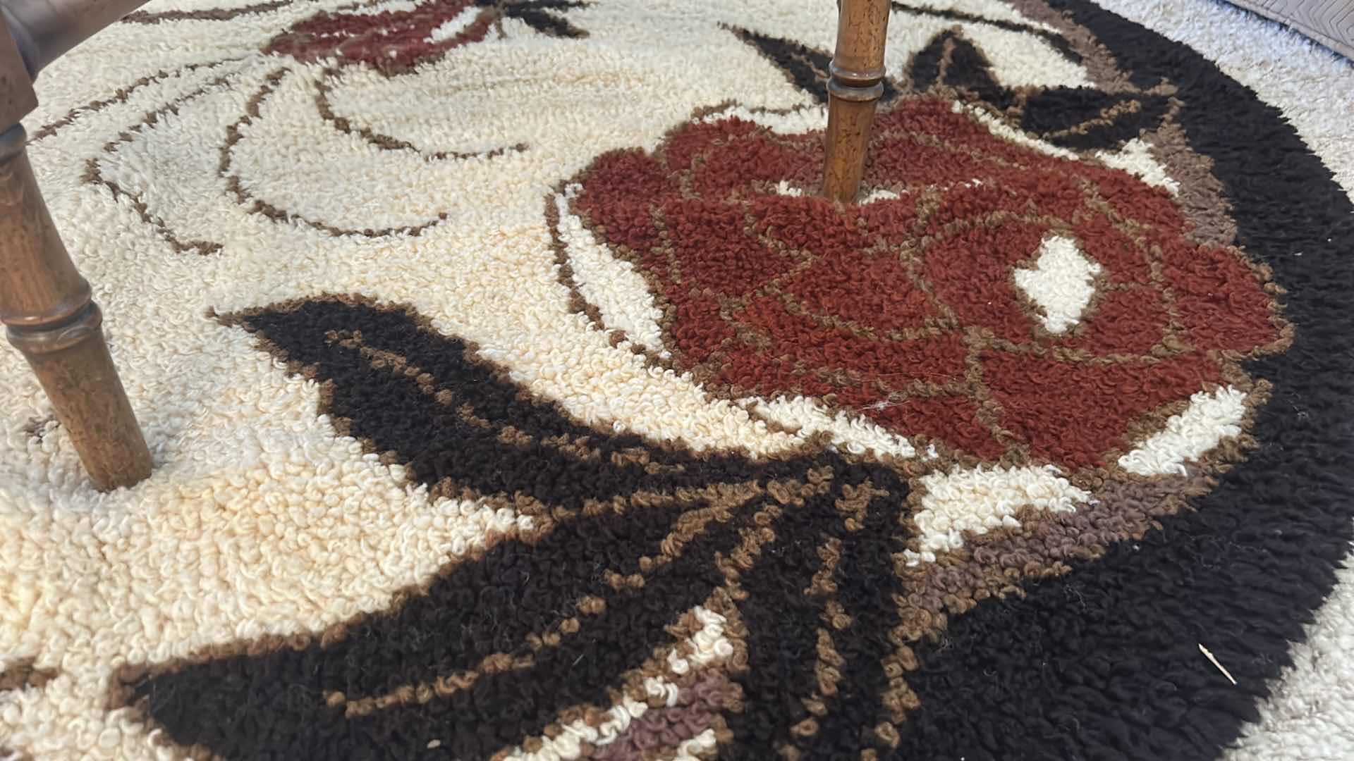 Photo 3 of BROWN AND BLACK AND CREAM 5’ ROUND LOW SHAG CARPET WITH RED FLOWERS