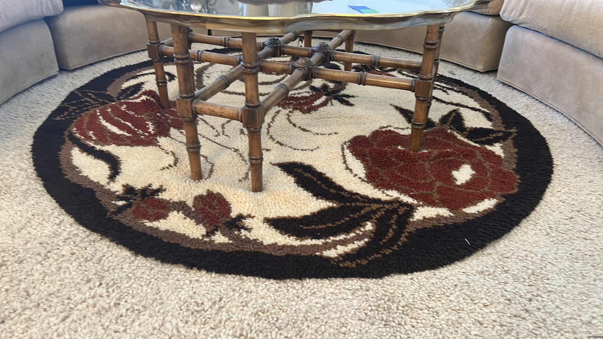 Photo 1 of BROWN AND BLACK AND CREAM 5’ ROUND LOW SHAG CARPET WITH RED FLOWERS