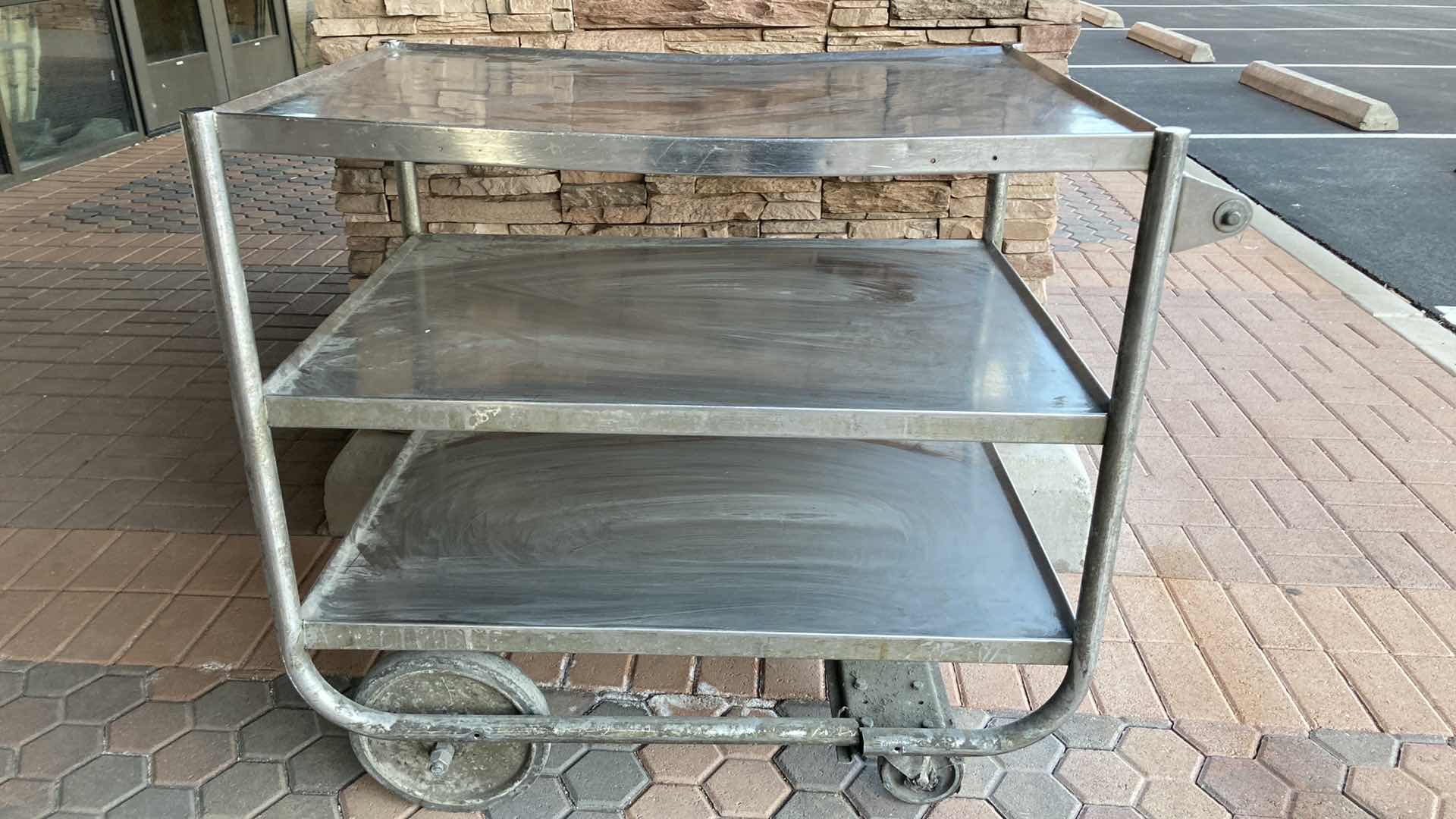 Photo 1 of STAINLESS STEEL 3 TIER ROLLING CART 40” X 27” H 35”
