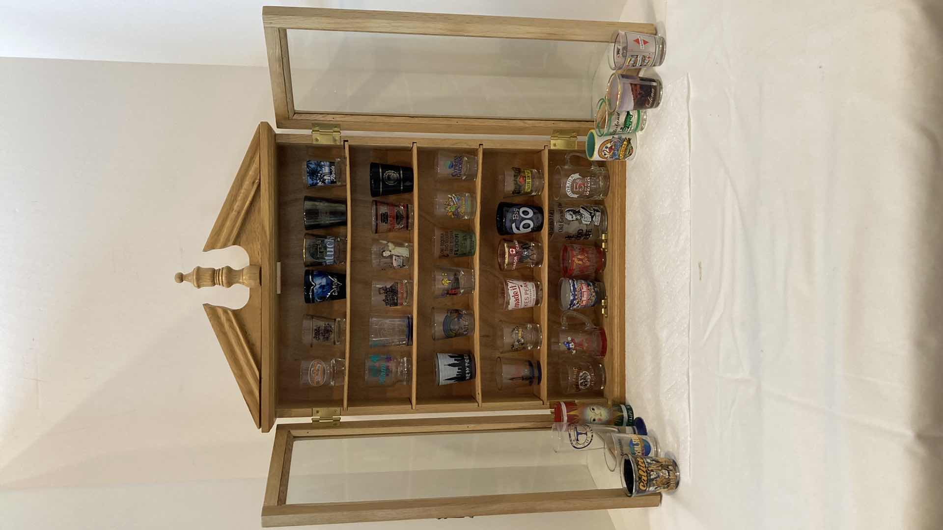 Photo 1 of SHOT GLASS COLLECTION W GLASS DOOR WOOD CABINET