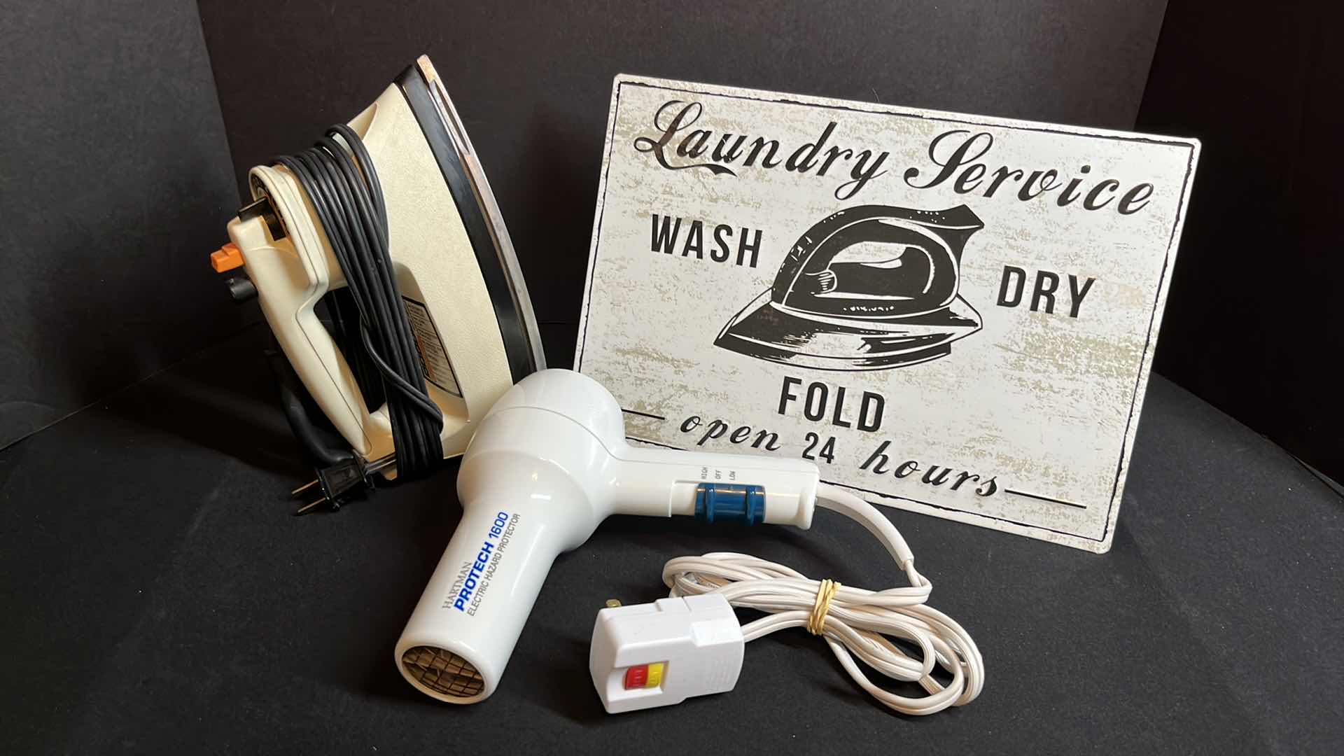 Photo 1 of BLACK&DECKER LIGHT N EASY SPRAY STEAM DRY IRON, HARTMAN PROTECH 1600 BLOW DRYER (MODEL E1600P) & VINTAGE STYLE LAUNDRY SERVICE METAL TIN DECOR 13” X 9”