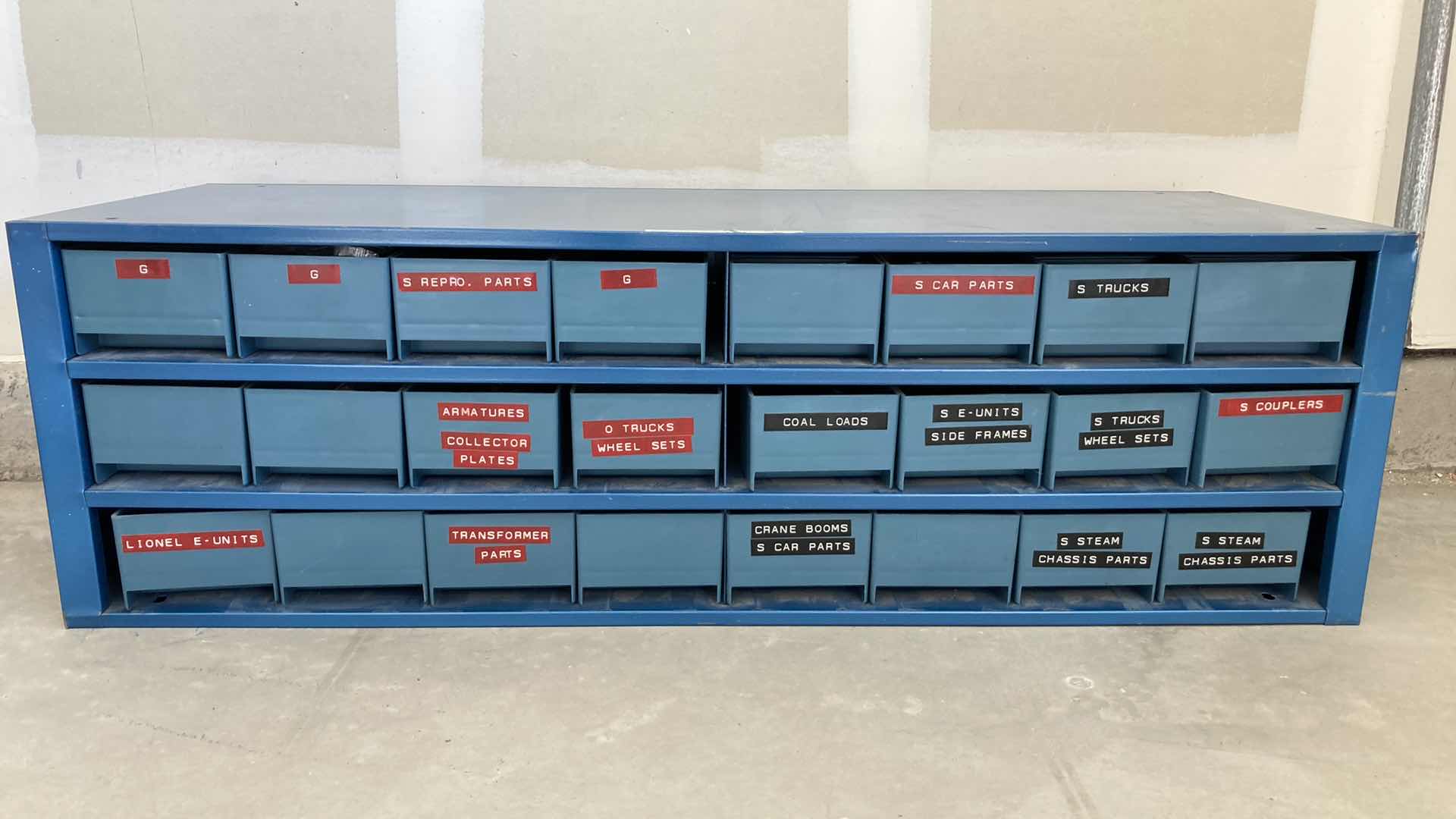 Photo 1 of BOWMAN 24 DRAWER STEEL STORAGE CABINET W MODEL TRAIN PARTS AS LABELED 35” X 12” H10.75”