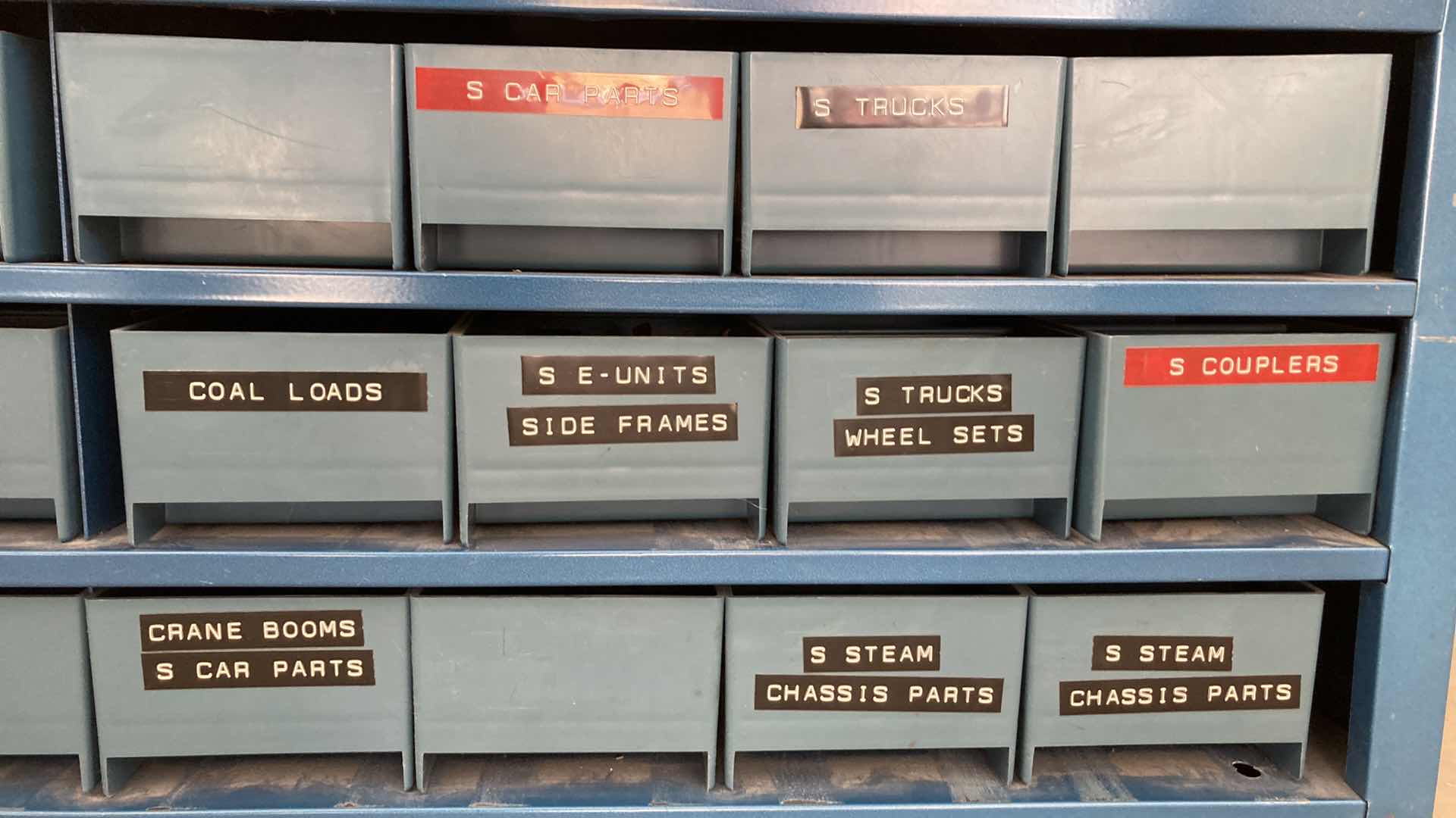 Photo 4 of BOWMAN 24 DRAWER STEEL STORAGE CABINET W MODEL TRAIN PARTS AS LABELED 35” X 12” H10.75”