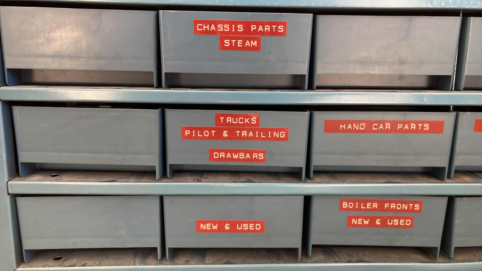 Photo 3 of BOWMAN 18 DRAWER STEEL STORAGE CABINET W MODEL TRAIN PARTS AS LABELED 35” X 12” H10.75”