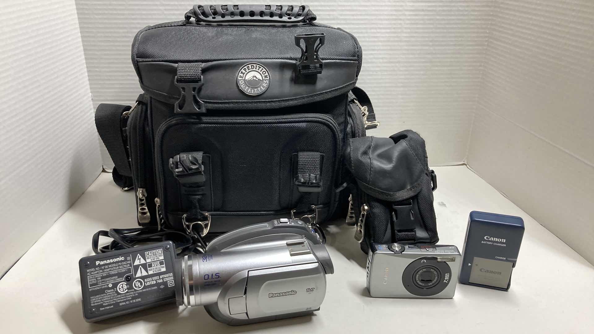 Photo 1 of PANASONIC DVD VIDEO CAMERA MODEL VDR-D220 & CANON POWERSHOT DIGITAL CAMERA MODEL SD750 W CHARGERS, BATTERIES & EXPEDITION OUTFITTERS CAMERA BAG