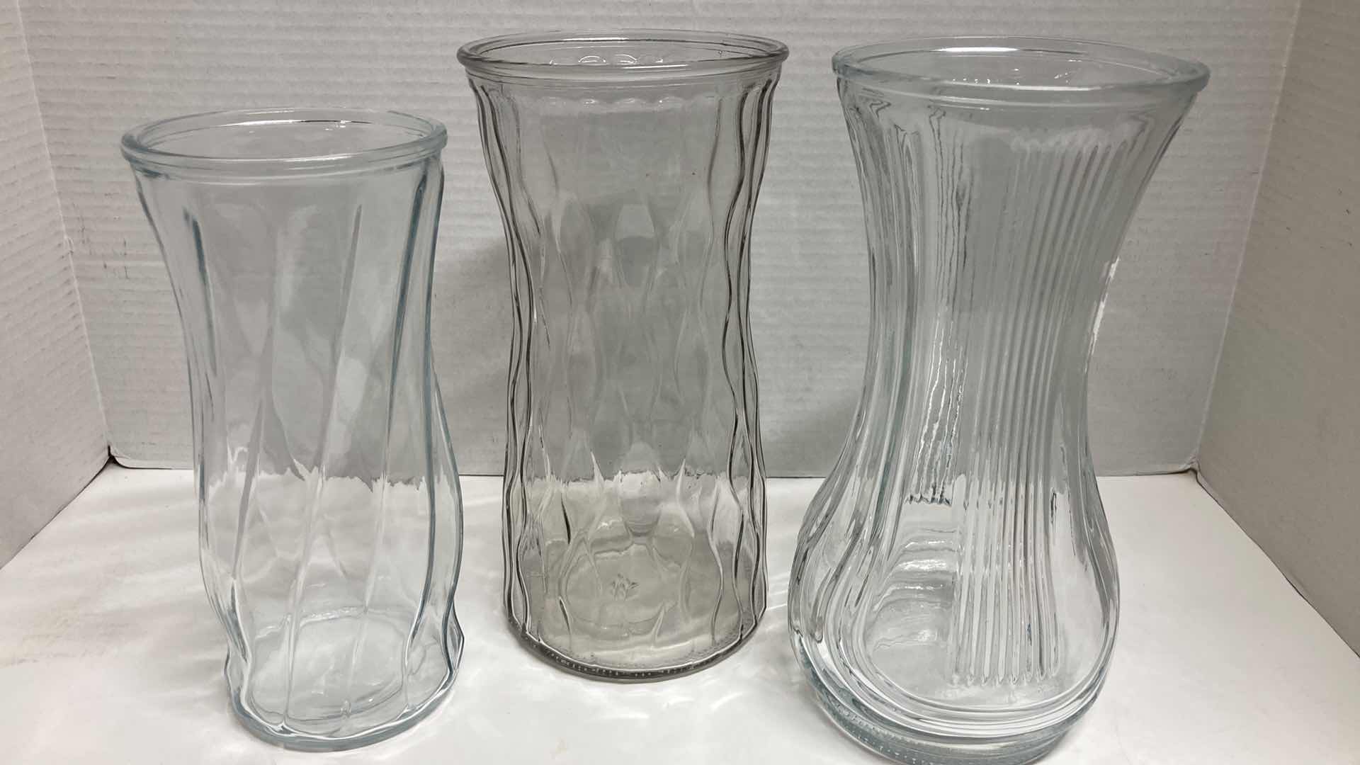 Photo 1 of CLEAR GLASS VASES- VARIOUS DESIGNS (3)