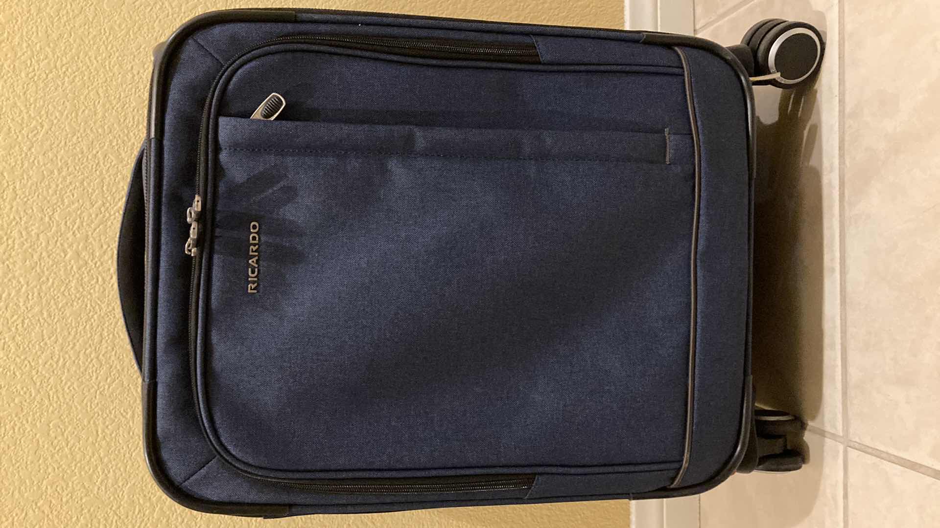 Photo 1 of RICARDO NAVY BLUE ROLLING CARRY ON BAG