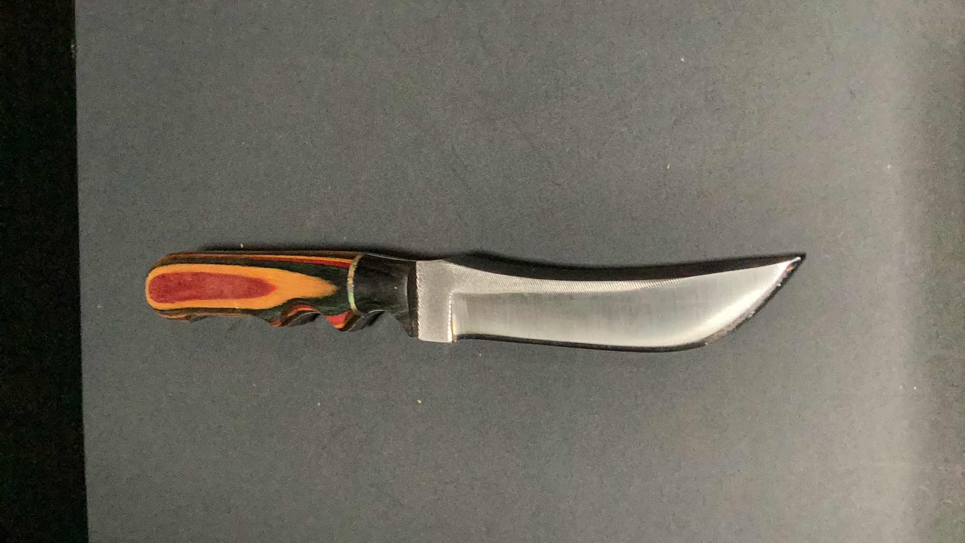 Photo 2 of MULTICOLORED WOODEN HANDLED 8” KNIFE