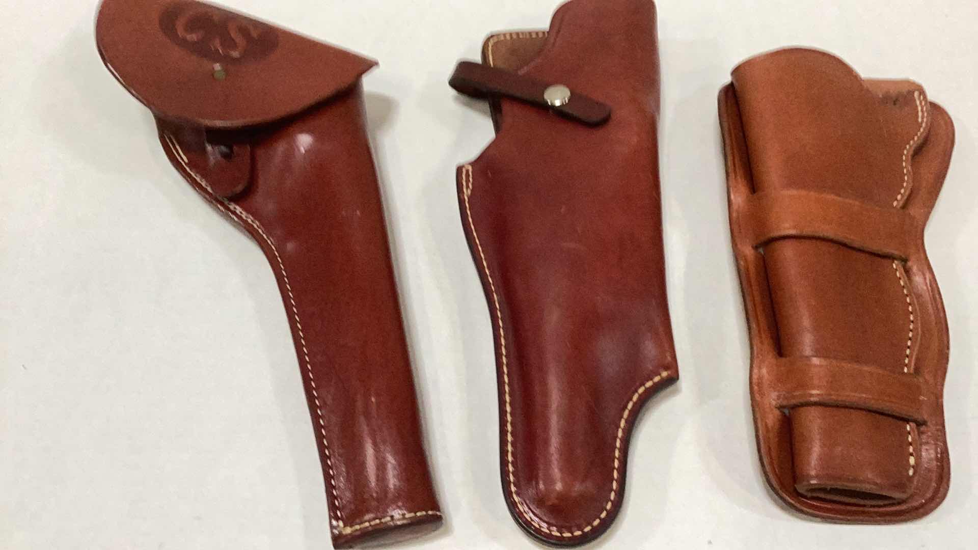 Photo 1 of THREE LONG BARRELED LEATHER HOLSTERS: THOMPSON CENTER ARMS, CALVARY HOLSTER