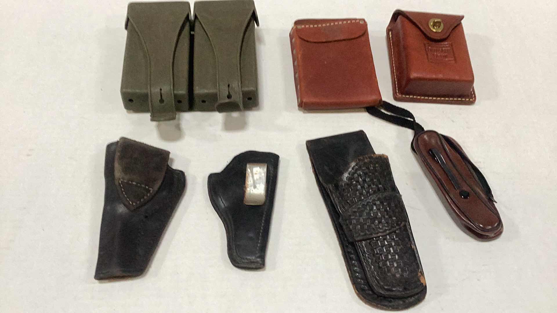 Photo 1 of HOLSTERS AND ASSORTED GOODS