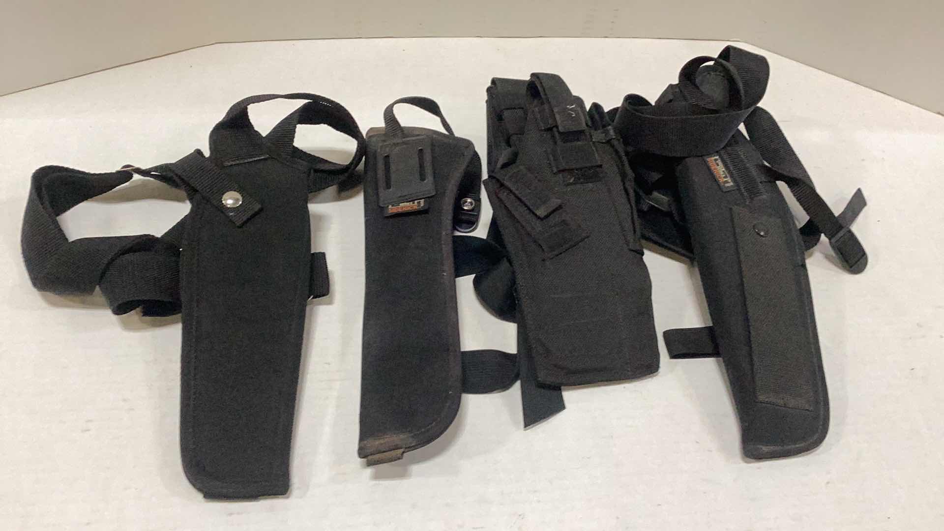 Photo 1 of FOUR PISTOL HOLSTERS