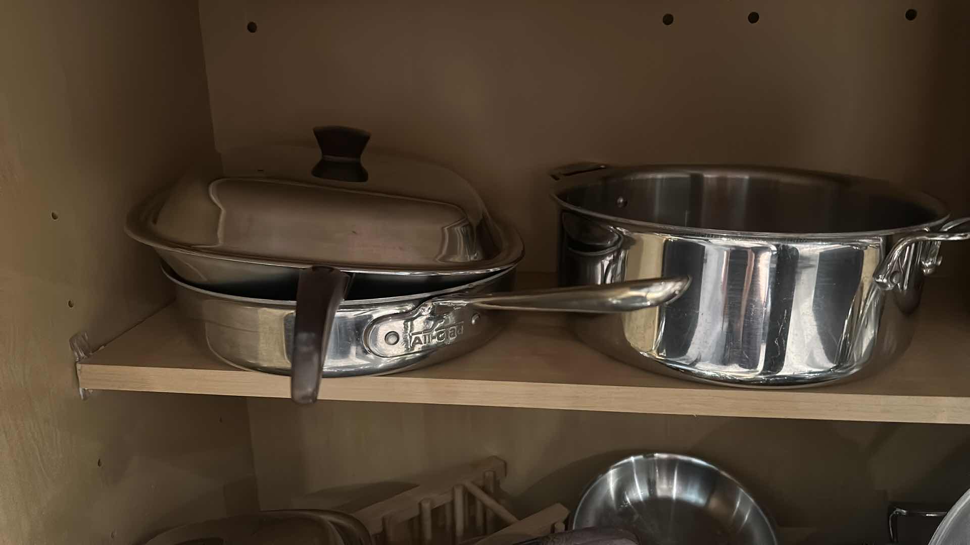 Photo 2 of ENTIRE CABINET OF POTS AND PANS