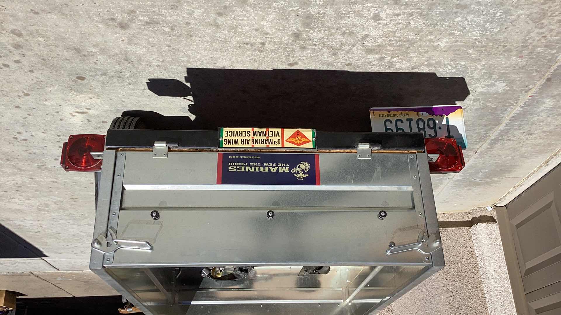 Photo 4 of HAUL-MASTER CARGO BOX TRAILER 55” X 35” HOLD UP TO 1000 POUNDS. INCLUDES, SAFTEY CHAIR, TAIL LIGHT WITH WIRING HARNESS, AND TWO WHEELS . D.O.T. CERTIFIED. TITLE IN HAND